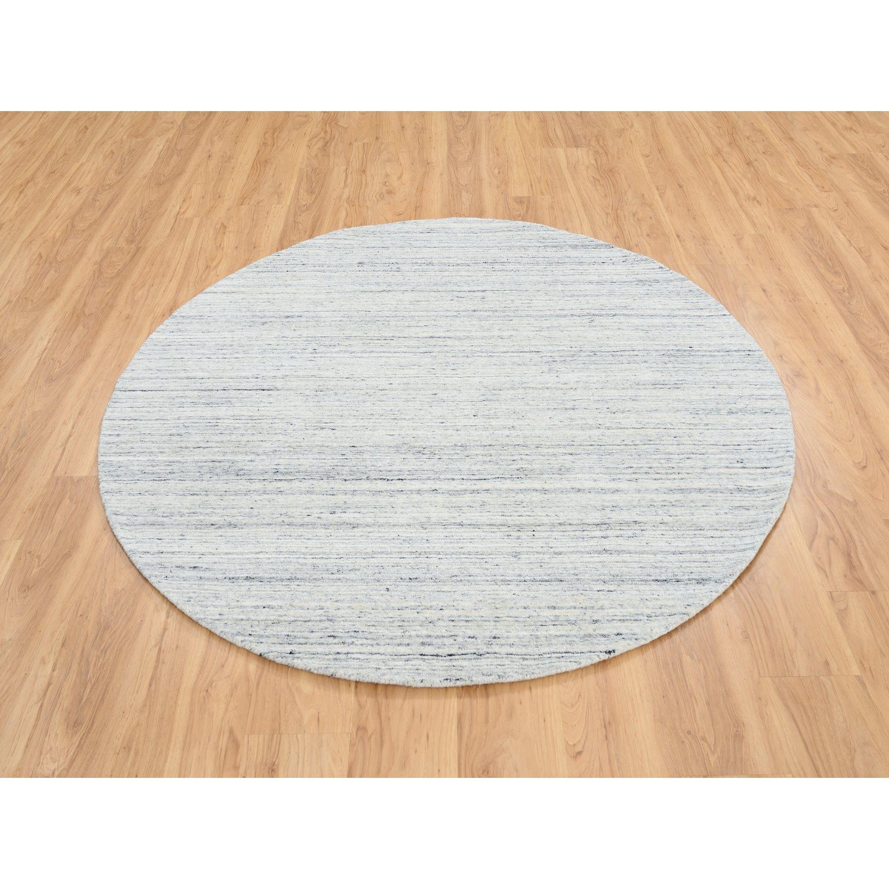 This is a truly genuine one-of-a-kind Ivory, Plain Modern Striae Design Soft Pile, Soft Wool Hand Loomed, Round Oriental Rug. It has been Loomed for months and months in the centuries-old weaving craftsmanship techniques by expert artisans.
Primary