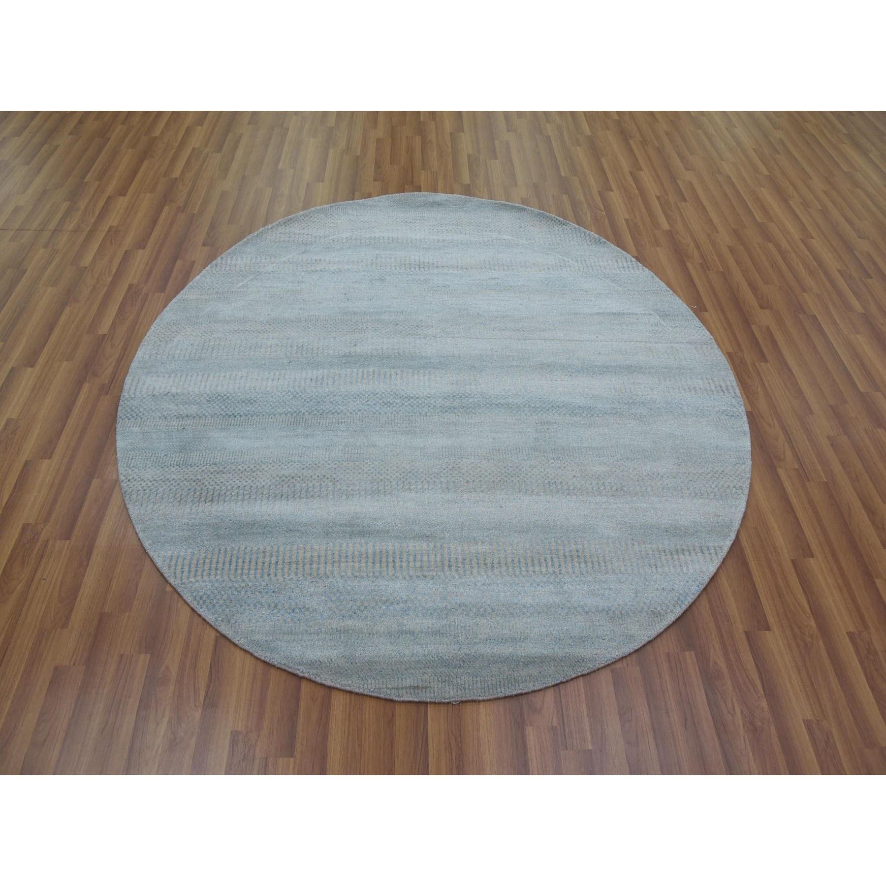 This is a truly genuine one-of-a-kind Light Blue, Densely Woven Wool and Silk Hand Knotted, Modern Grass Design Gabbeh, Round Oriental Rug. It has been Knotted for months and months in the centuries-old weaving craftsmanship techniques by expert