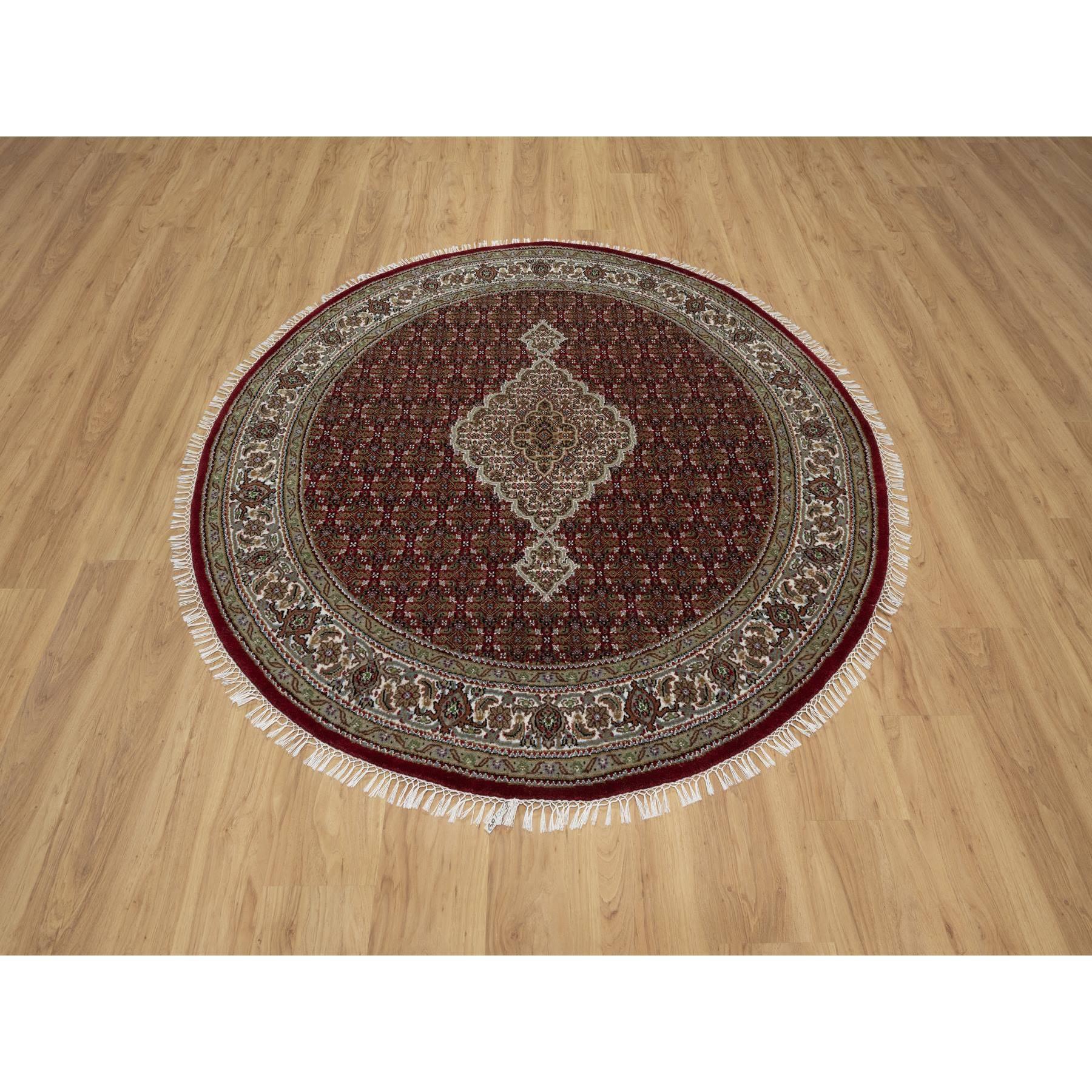 Scarlet Red, Tabriz Mahi with Fish Medallion Design, Pure Wool, Hand Knotted, Densely Woven, Round, Oriental Rug
Primary materials: Wool
Latex: No Pile 
height: 0.25 Inches
Style: Traditional
Primary color: Red
Secondary colors: Gray, Green, Brown,