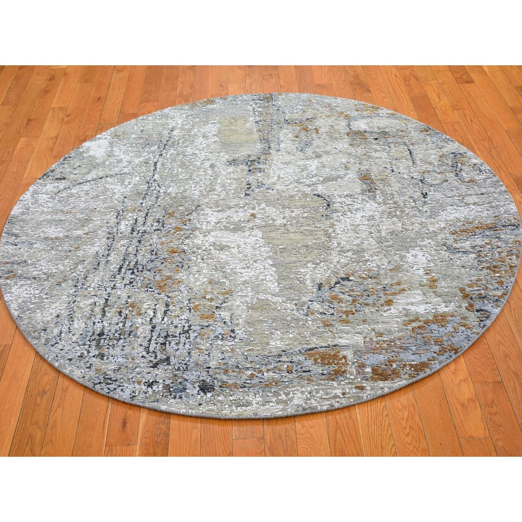 This is a truly genuine one-of-a-kind Wool Denser Weave Taupe Persian Knot with Abstract Design Hand Knotted Round Oriental Rug. It has been woven for months and months in the centuries-old Persian weaving craftsmanship techniques by expert