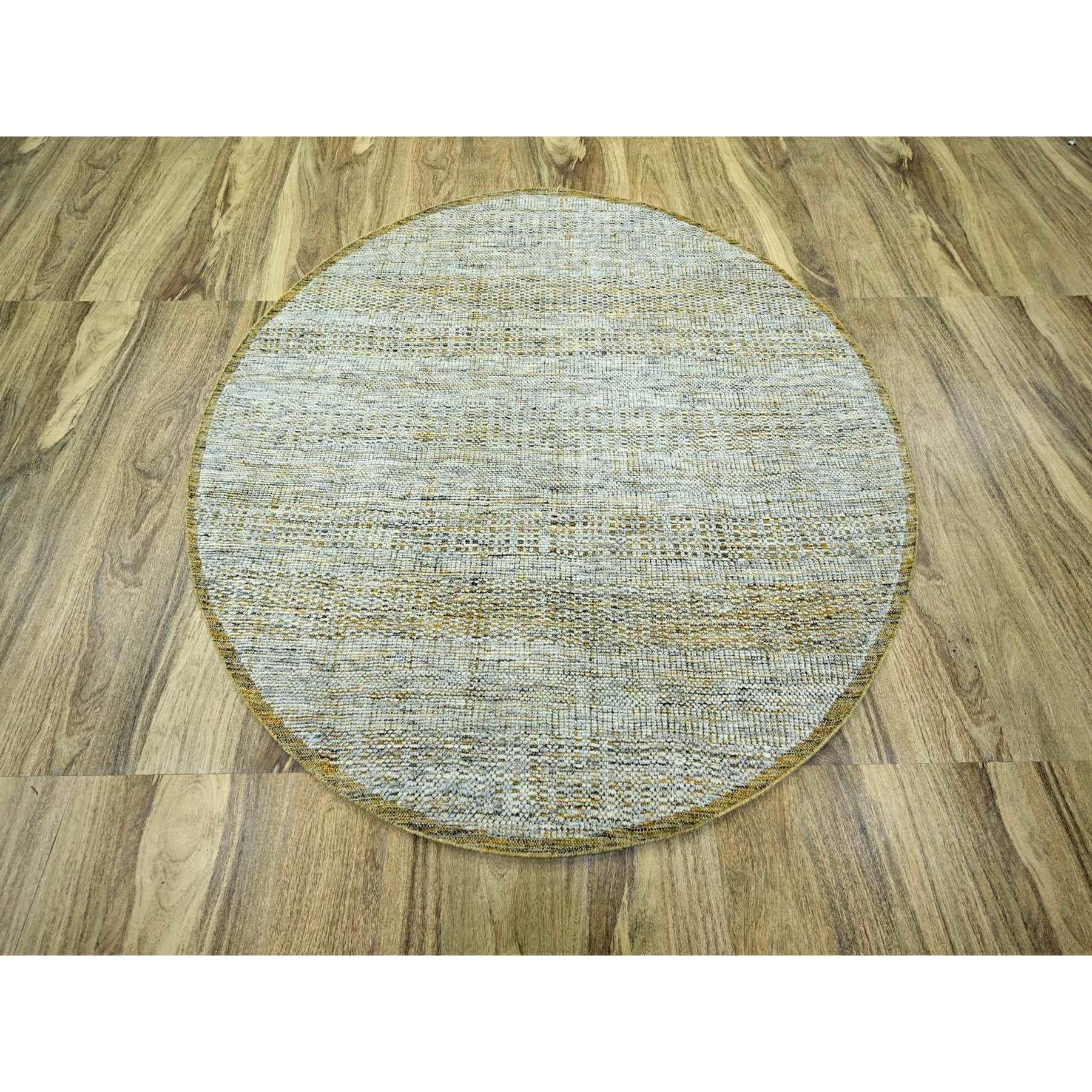 Gold, Oxidized and Distressed Grass Design with Exposed Warps, Hand Knotted, 100% Wool, Round, Oriental Rug
Primary materials: Wool
Latex: No Pile 
height: 0.25 Inches
Style: Contemporary
Primary color: Gold
Secondary colors: Gray, Ivory,