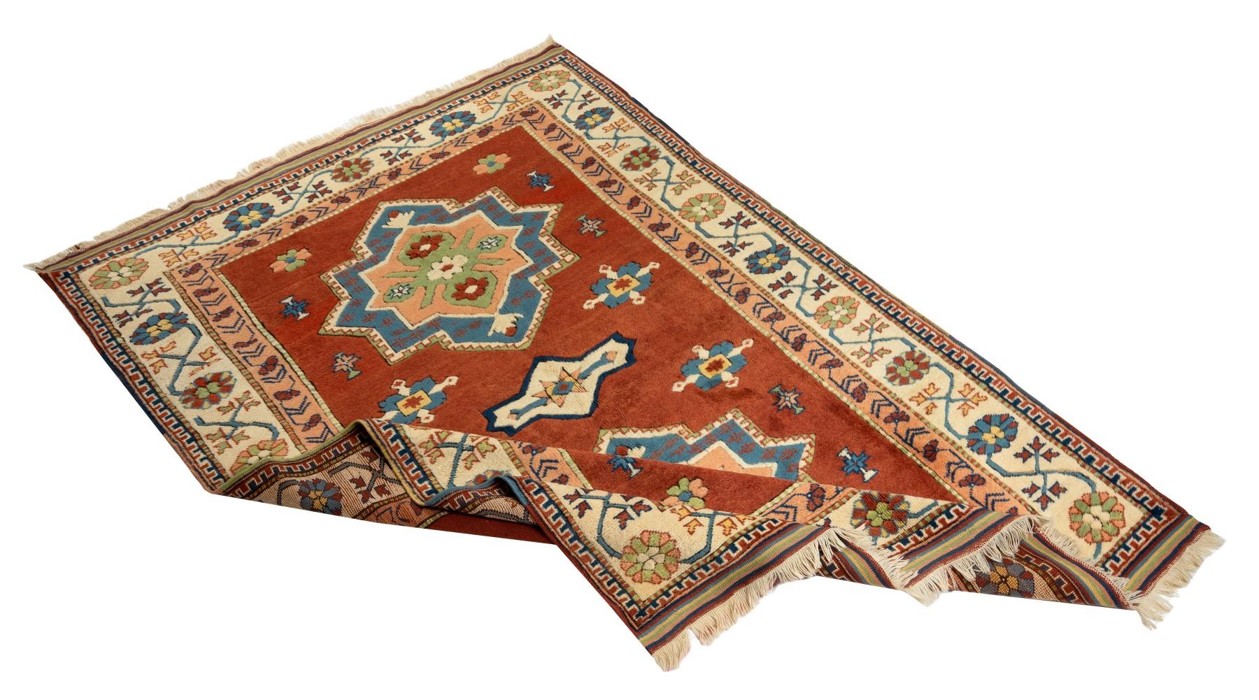 A new hand-knotted Turkish rug with excellent, lustrous, soft medium wool pile. The rug features two large geometrical medallions as well as several other smaller ones in bright cerulean blue, peach, ivory and celadon green floating across the field