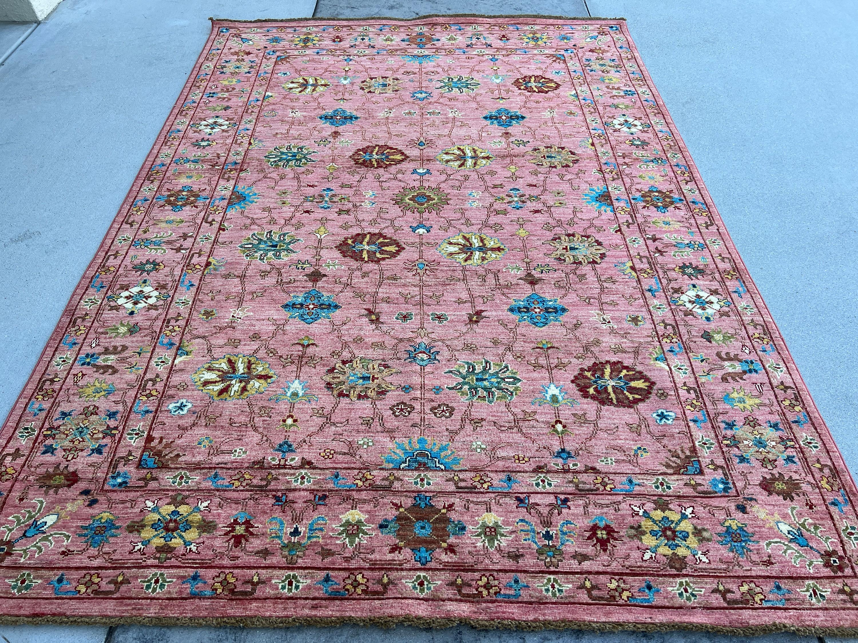 This rug was made with 100% premium, Afghan-sourced Ghazni wool with a cotton foundation. The rich colors are dipped in natural dyes to create an heirloom finish that does not bleed and is meant to last for generations. Sourced through fair trade