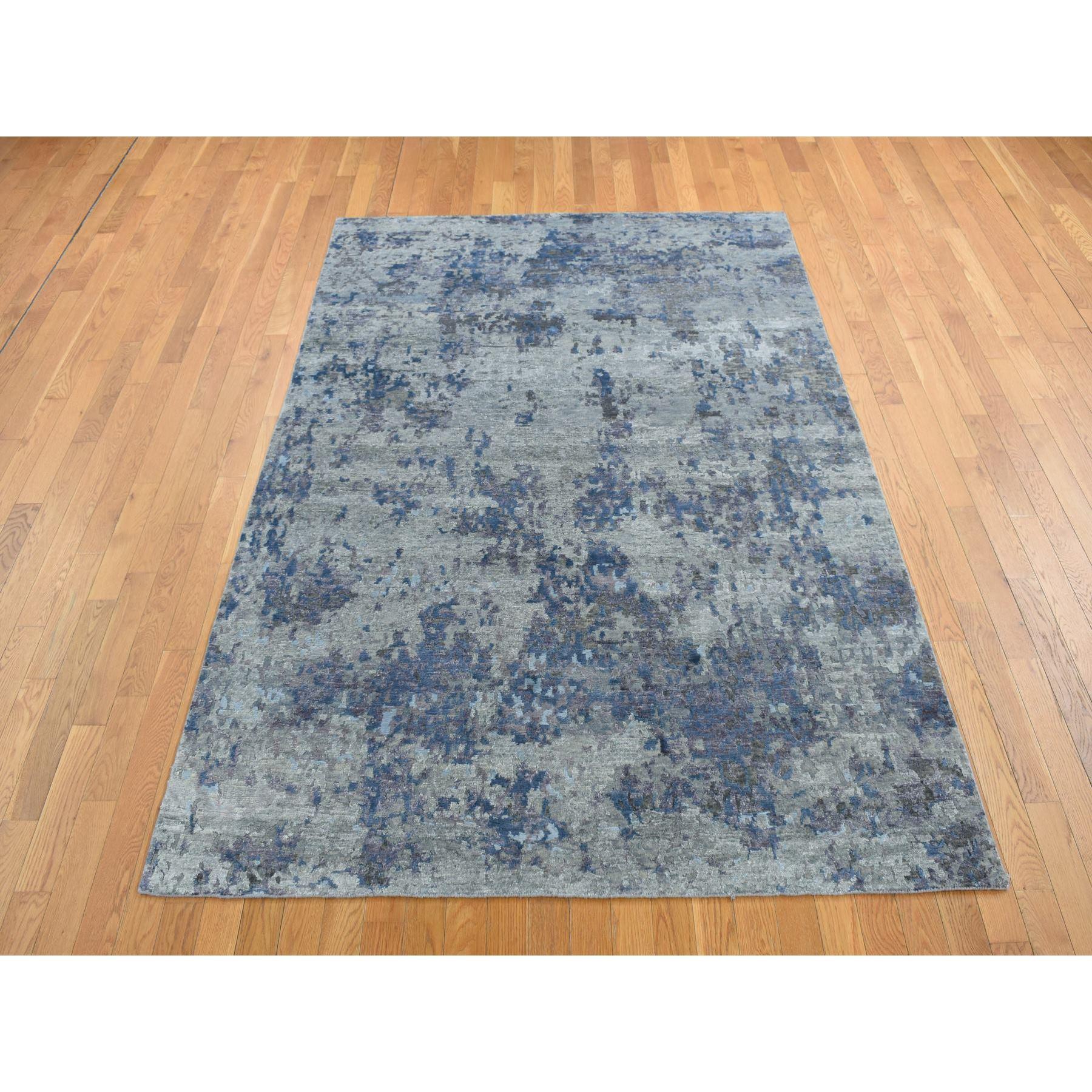 Cloud Gray, Hi-Low Pile, Abstract Design, Wool and Silk, Soft to The Touch, Hand Knotted, Oriental Rug
Primary materials: Wool & Silk
Latex: No Pile 
height: 0.25 Inches
Style: Transitional
Primary color: Grey
Secondary colors: Blue, Ivory
Pattern: