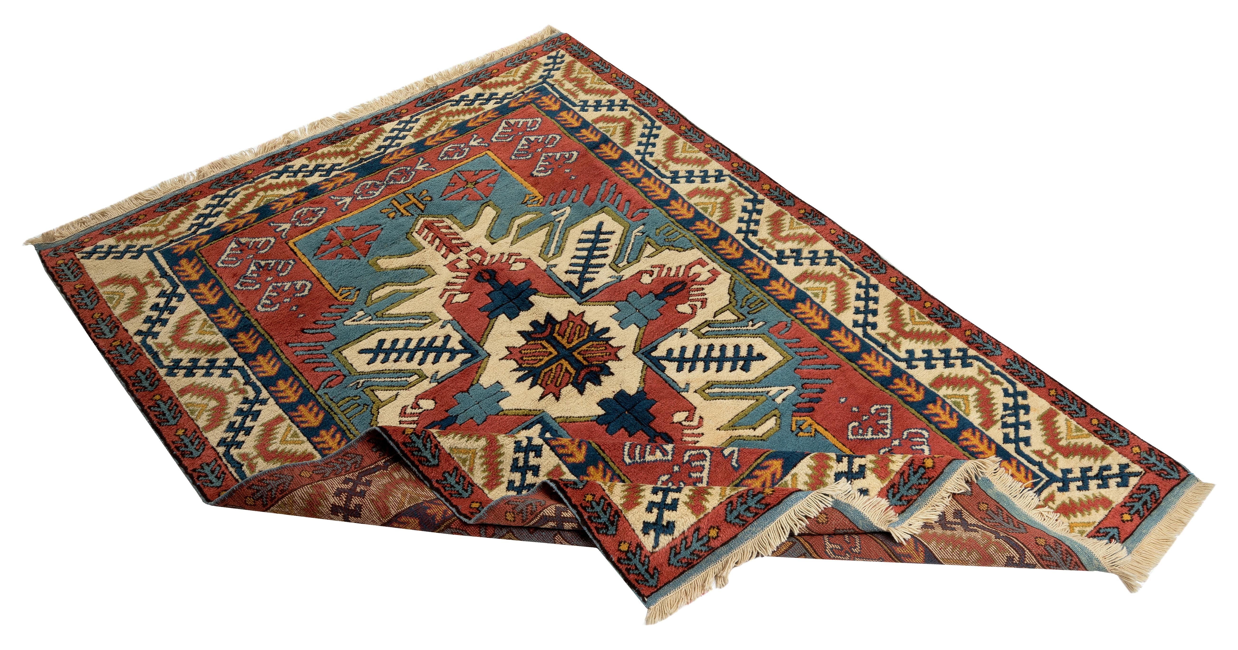 A brand new hand-knotted Turkish rug with excellent, lustrous, soft medium wool pile. The rug features a geometric latch-hook medallion design and a border decorated with half latch hook medallions and a running water motif all in a vivid color