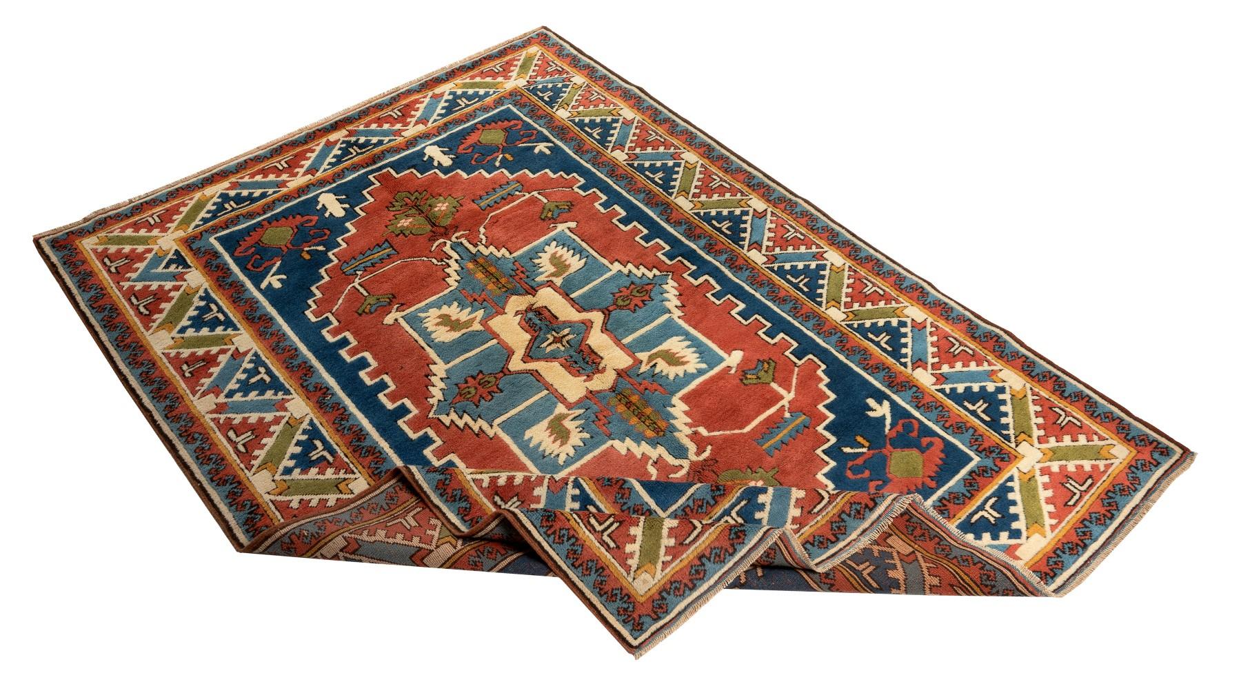 A brand new hand-knotted Turkish rug with excellent, lustrous, soft medium wool pile. The rug features a geometrical latch-hook medallion design and a border decorated with half stepped medallions in a gorgeous color palette of deep, saturated and