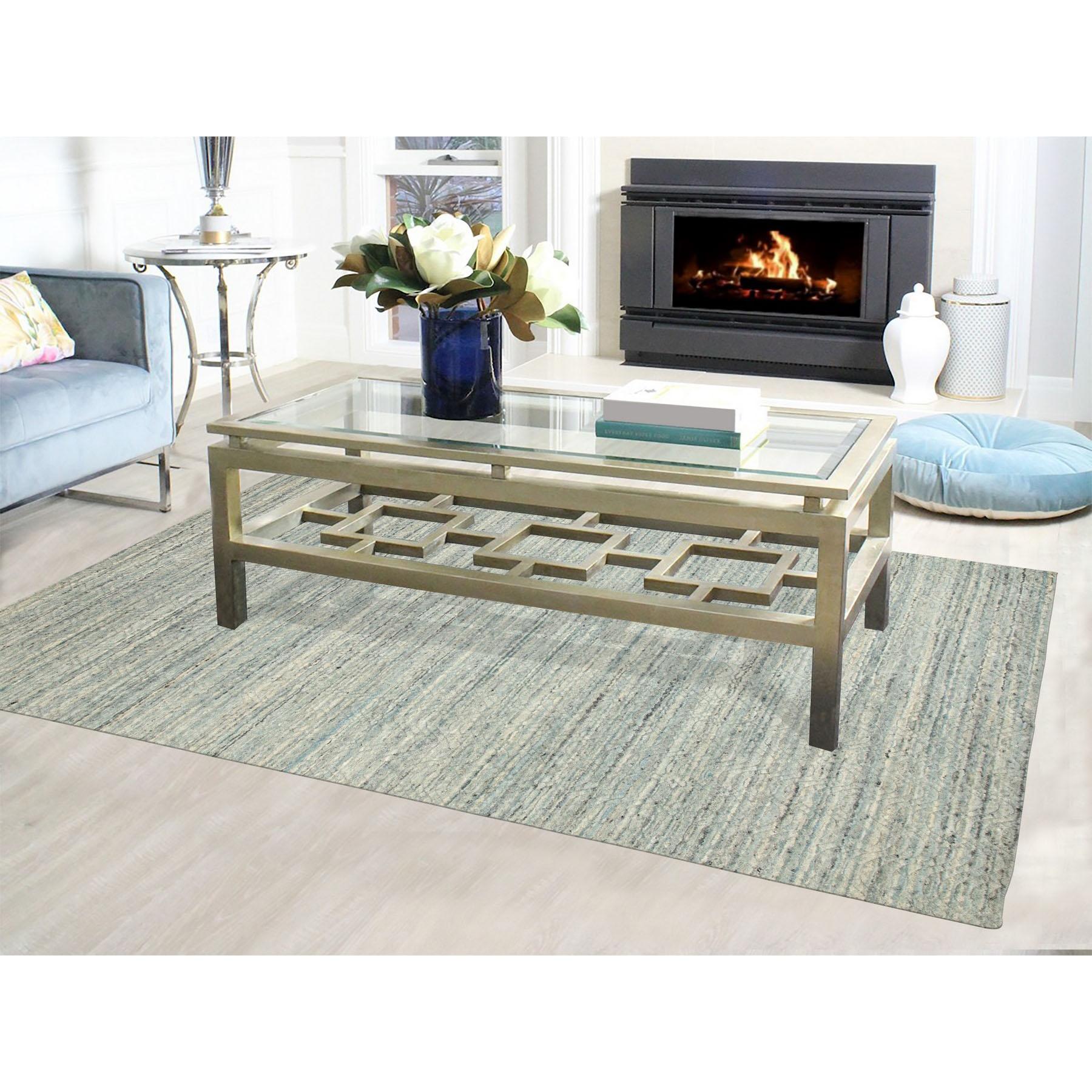 This is a truly genuine one-of-a-kind Seafoam Green Variegated Textured Design Hand Loomed Pure Wool Modern Oriental Rug. It has been woven for months and months in the centuries-old Persian weaving craftsmanship techniques by expert