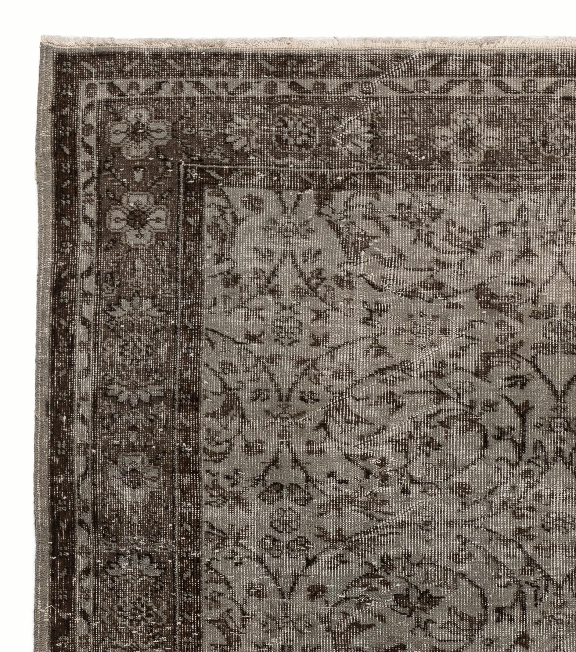 A vintage Turkish area rug re-dyed in gray color for contemporary interiors.
Finely hand knotted, low wool pile on cotton foundation. Professionally washed.
Sturdy and can be used on a high traffic area, suitable for both residential and