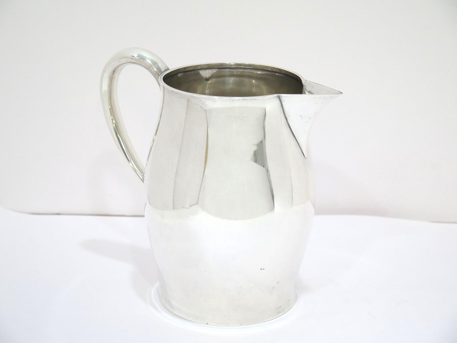 Dimensions (H x L x D): 7 7/8 x 8.25 x 5.5 in
Weight: 23.5 toz
This pitcher was not made by Paul Revere but its pattern is called 
