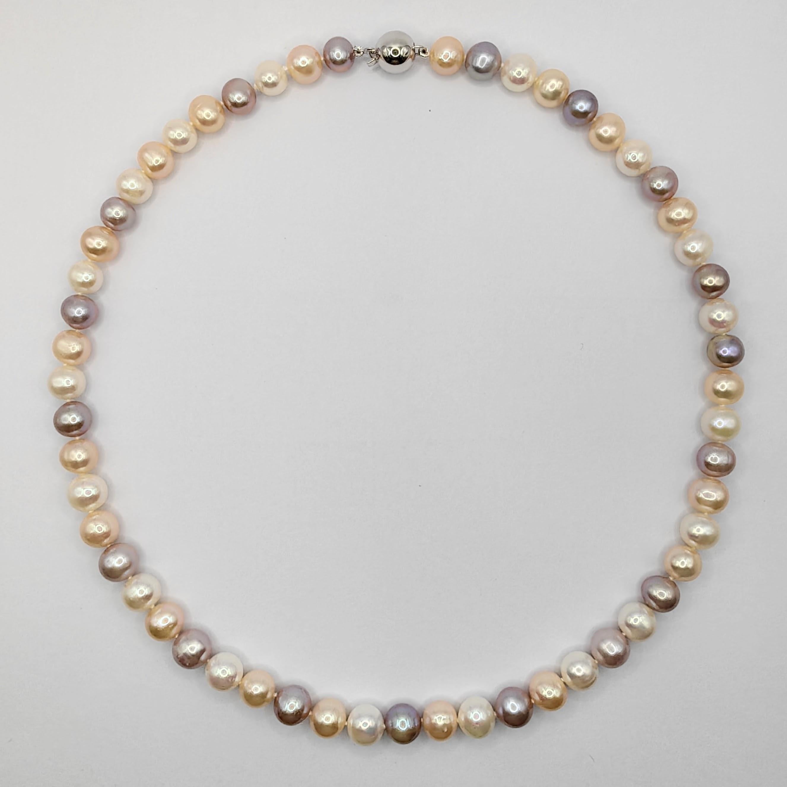 Introducing our 18-inch 7-8mm Multi-color Pink Peach White Round Pearl Necklace, a beautifully hand-knotted accessory that adds a touch of sophistication and style to both men's and women's wardrobes. These candy-colored pearls, with their