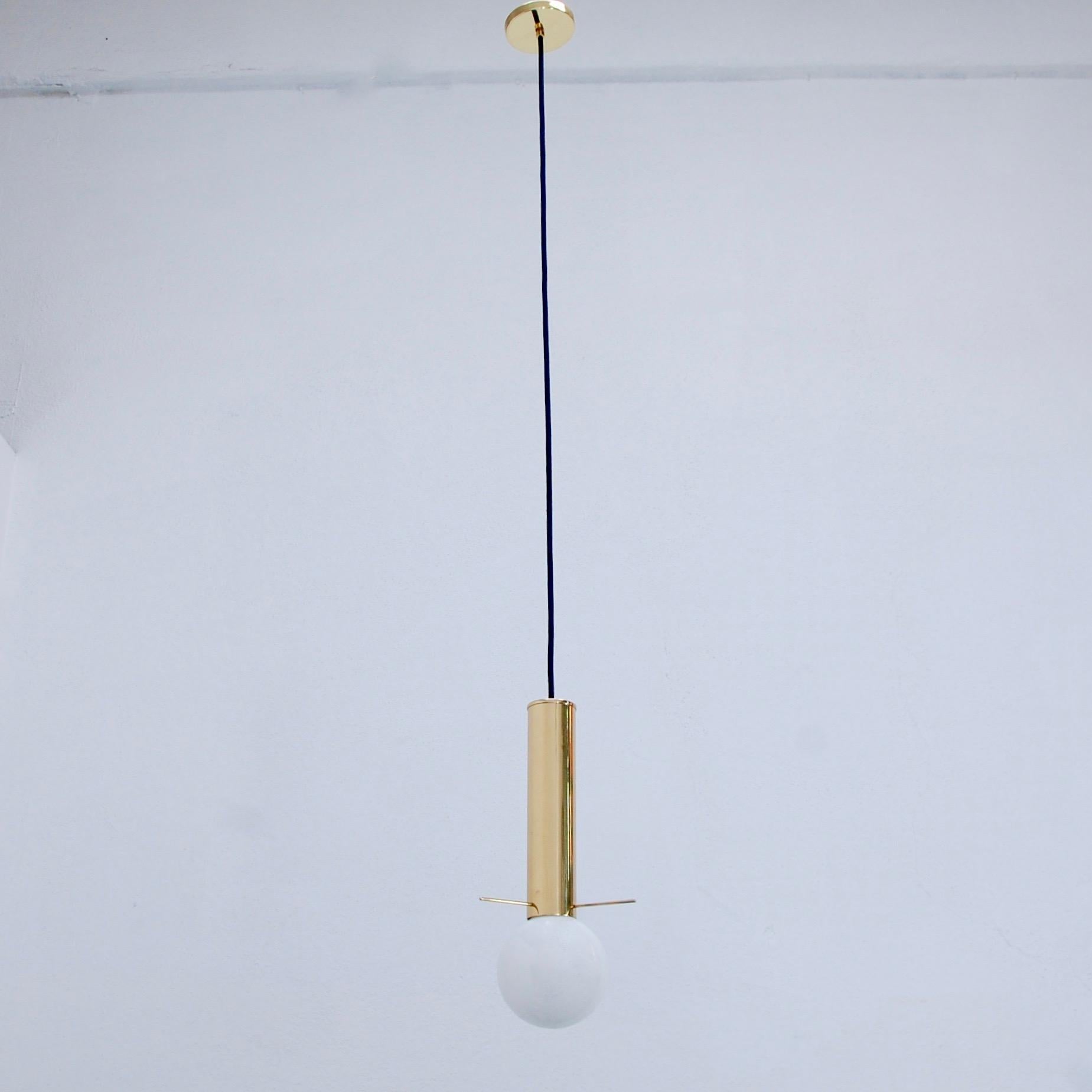 (7) Of the period American 1960s brass pendants with G40 LED bulbs and tri-pin detailing. Fully restored. Wired for the US with a single E26 based socket. Light bulb included with order. Overall drop adjustable upon request. Sold