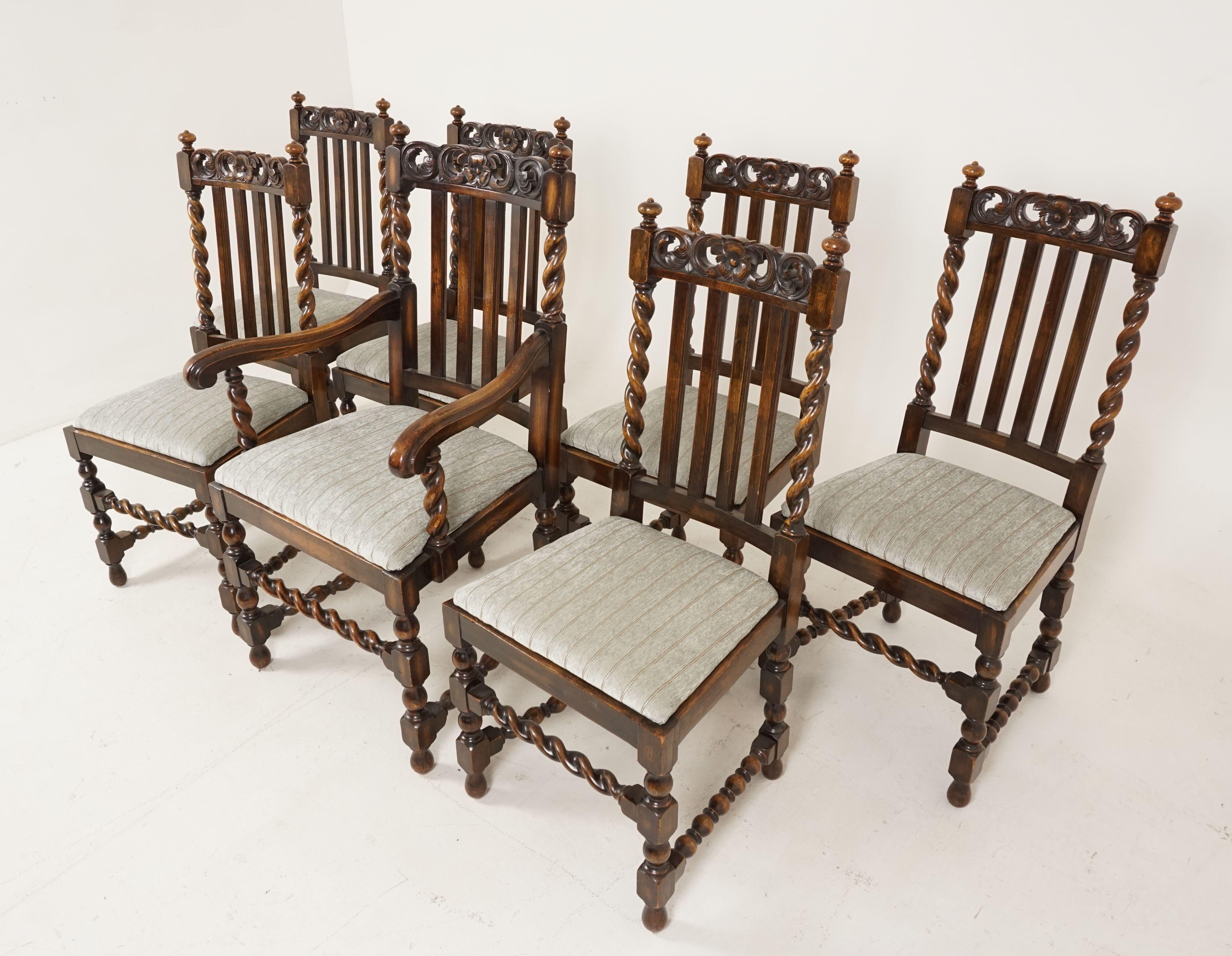 7 antique oak barley twist dining chairs, lift out seats, Scotland 1920, B2499.

Scotland, 1920
Solid oak
Original finish
Carved floral rail on top
Vertical slats in the center
Pair of barley twist supports on the ends with finials to the
