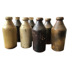 7 Antique Stoneware Gin Bottles