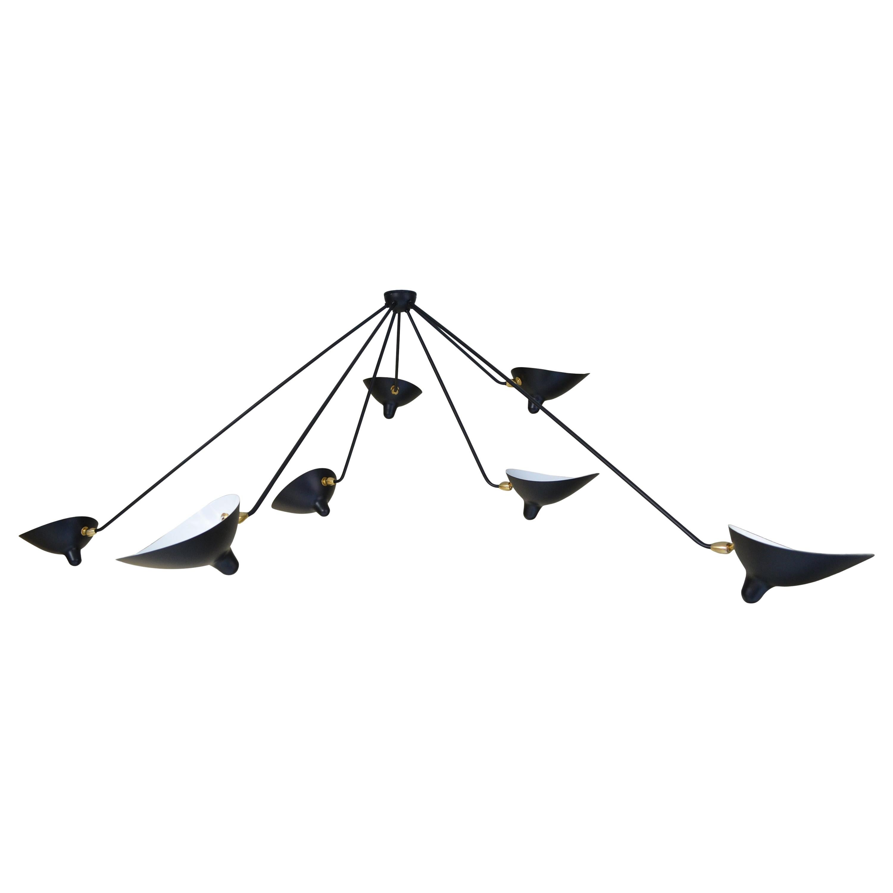 This lamp with rotating heads on seven fixed arms is a statement as much as it is a ceiling lamp - one that will command the conversation.

Available in white or black. Brass swivels connect the shades.

COLOR OPTION
Available in Black or