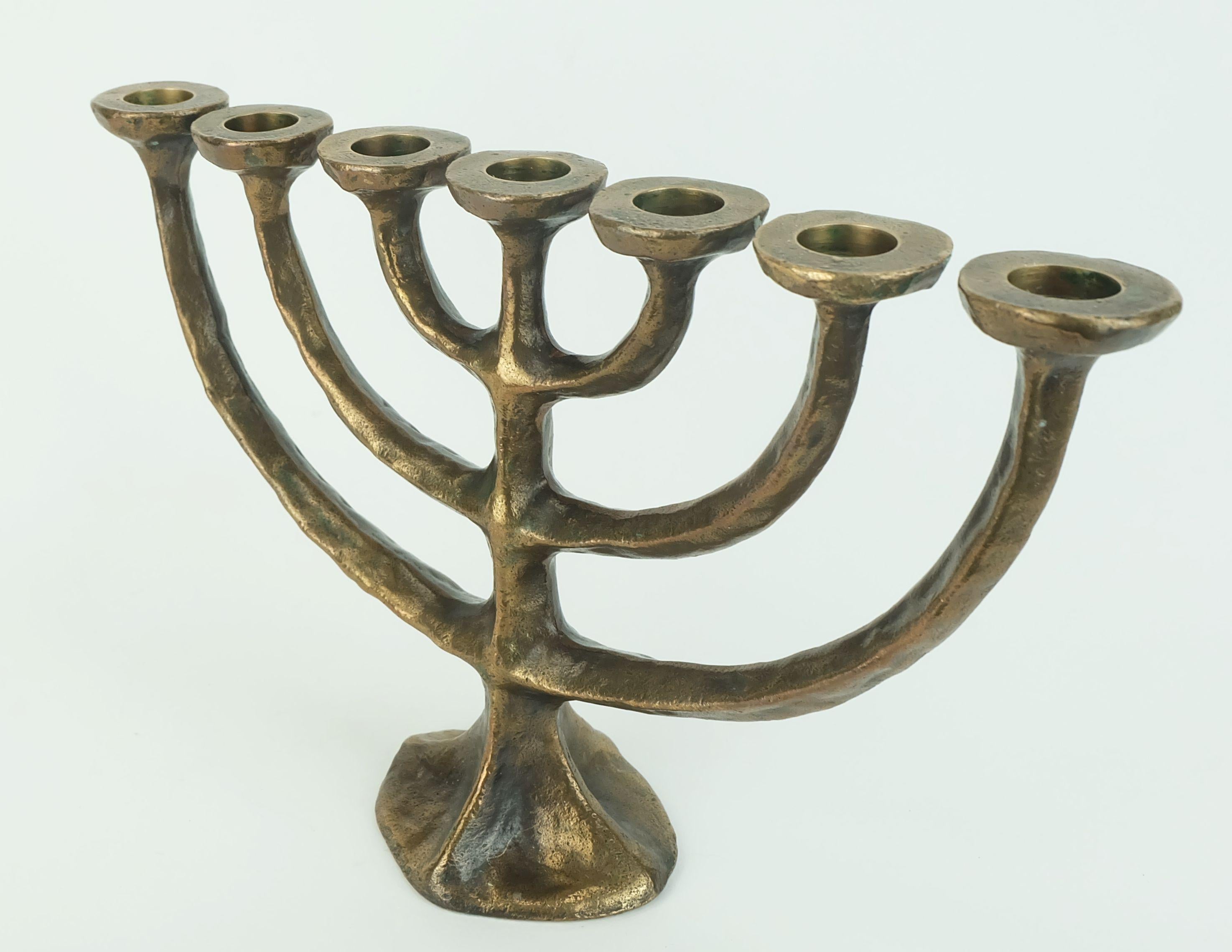 Fantastic heavy 1960s 70s candleholder for 7 candles. Made of cast bronze. A perfect addition to any mid century interior. 

Dimensions in cm:
Height 20 cm, width 30 cm, depth 8.7 cm.

Dimensions in inches:
Height 7.87