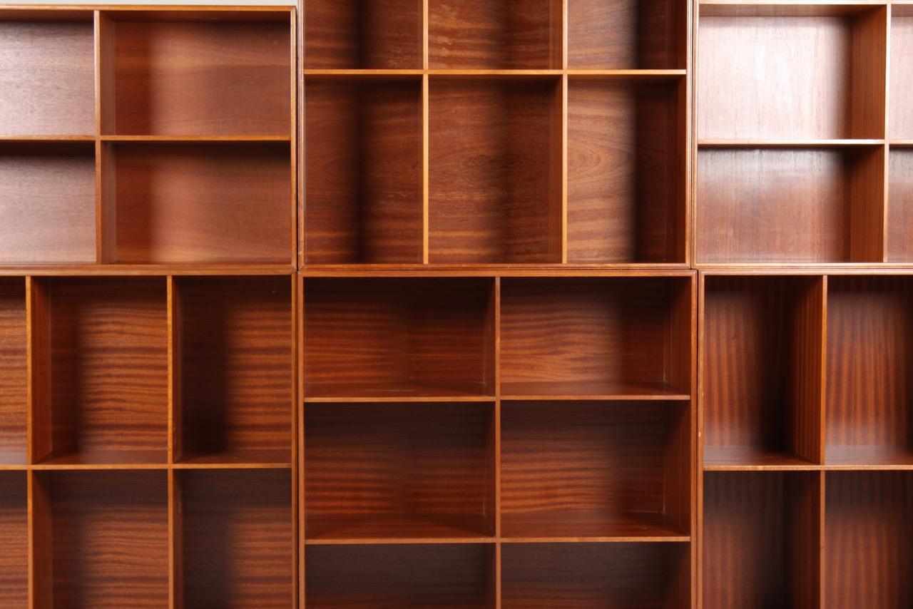 7 section bookcase in solid mahogany designed by MAA. Mogens Koch for Rud. Rasmussen Cabinetmakers. Seven open bookcases, can be used on the floor or wall-mounted.
