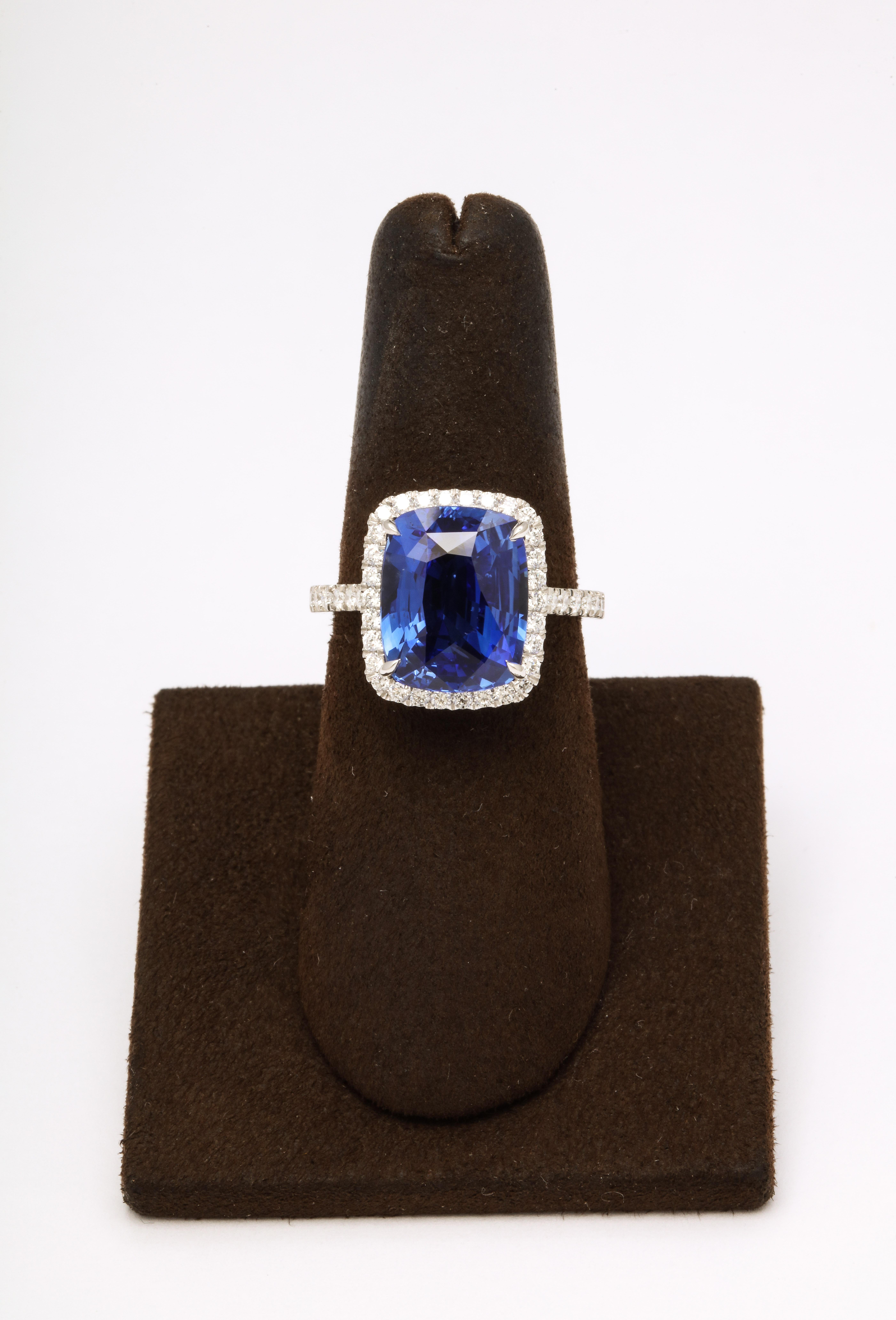 
A fabulous sapphire set in a beautiful, and wearable diamond mounting. Full of sparkle and brilliance! 

A magnificent 7.15 carat Blue Sapphire set in a custom platinum halo diamond mounting with .65 carats of colorless white round brilliant cut
