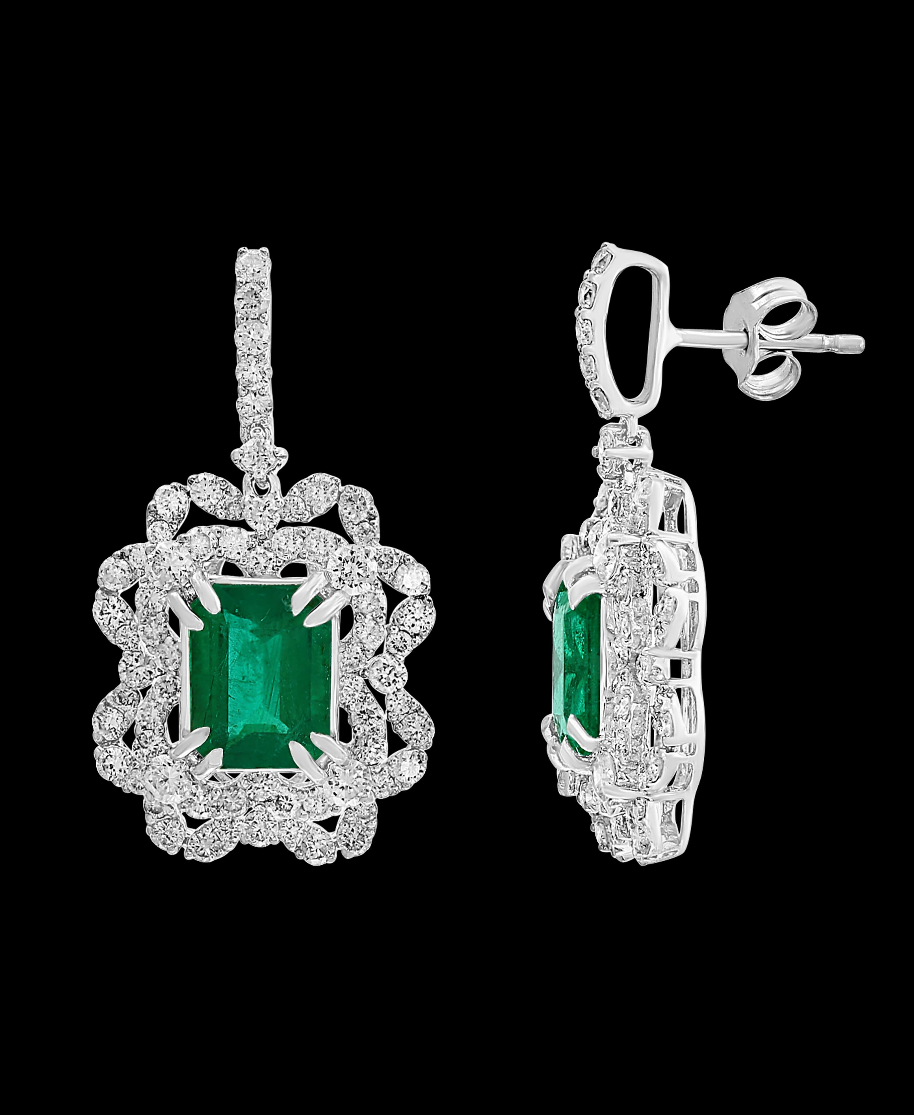 7 Carat  Colombian Emerald Cut Emerald Diamond  Hanging Earrings 18 K White Gold
This exquisite pair of earrings are beautifully crafted with 18 karat White gold  weighing  9 grams
Two fine Natural   Colombian Emerald  Cut Emeralds weighing