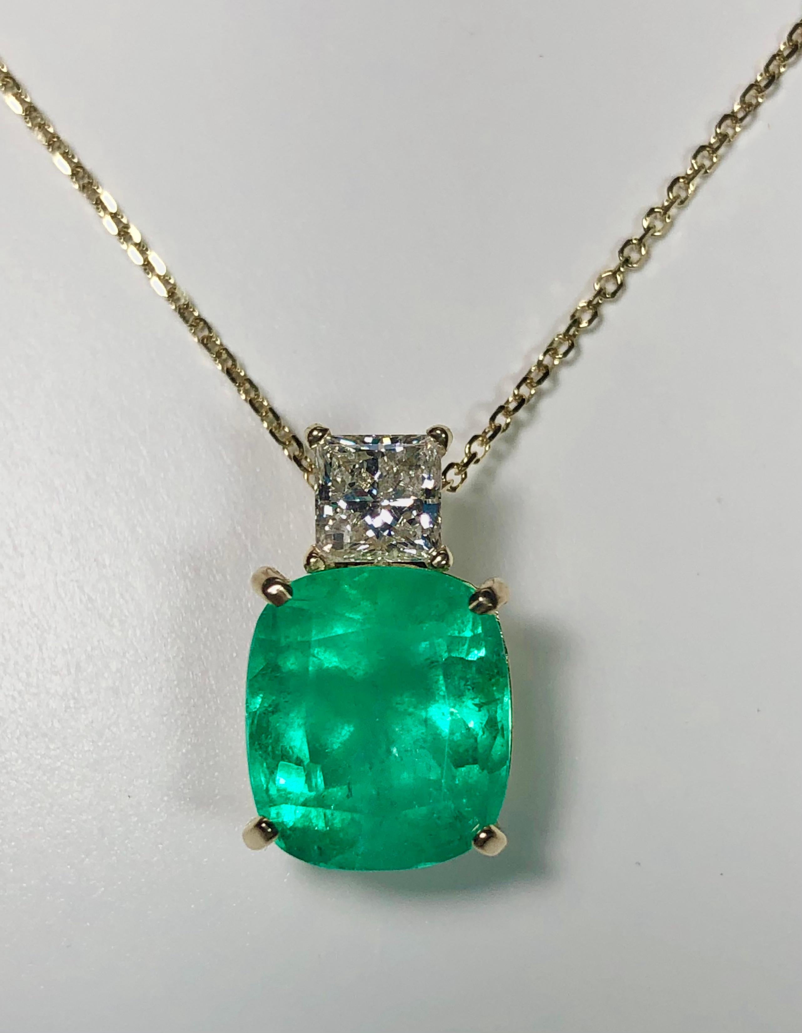 
Details: Origin Colombian Emerald 
Cushion-Cut, Color: Forest Medium Green, Carat: 6.15 Carat 
Diamond Details: 
Princess Cut, Carat: 0.85 Carat Total Weight, Color: G Clarity: SI2  
Metal Type: 18 Karat Yellow Gold 
Weight: 5.6 grams  
Stunning