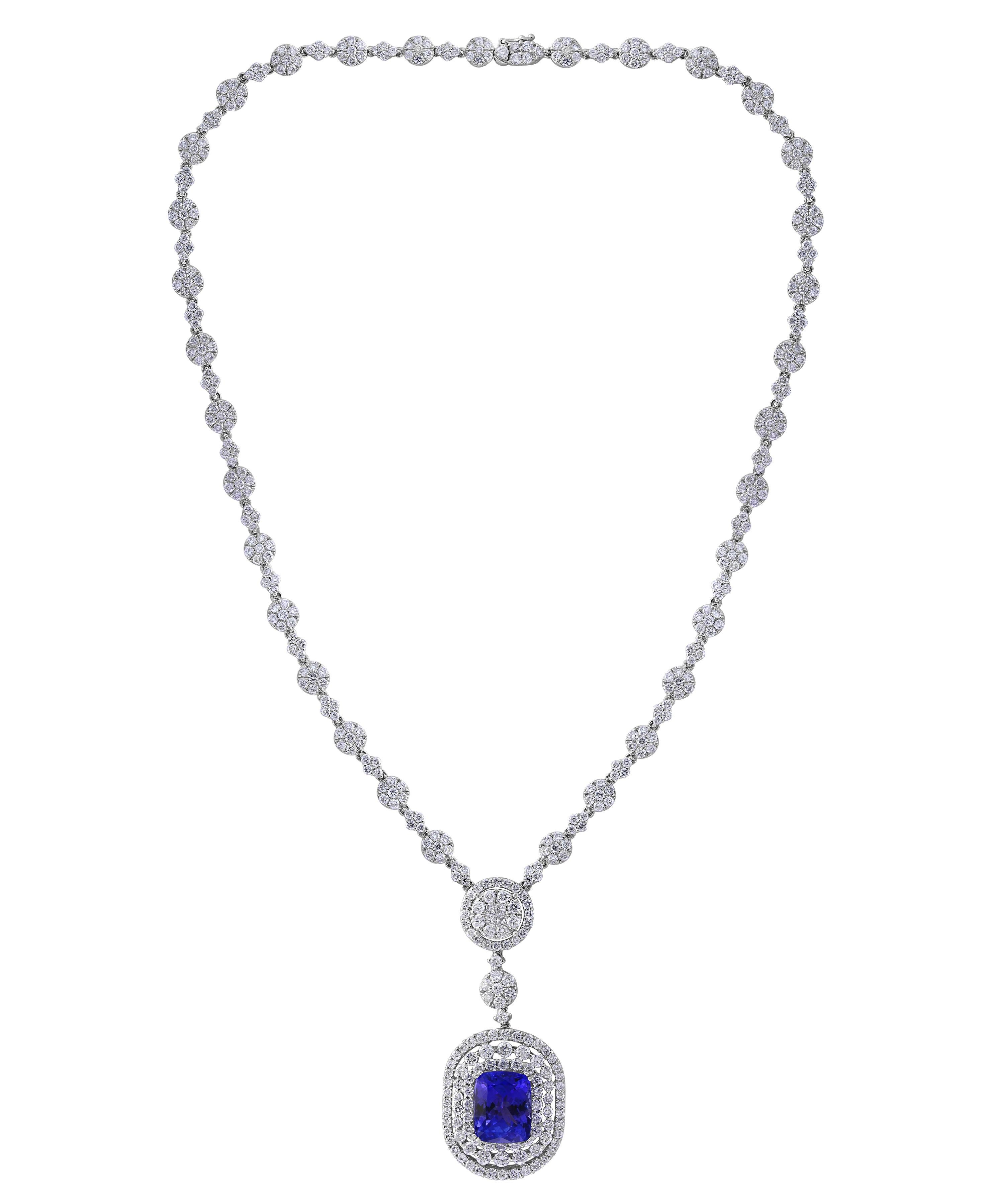 7 carats of fine  quality of   Cushion Shape Tanzanite pendant surrounded by brilliant round  cut Diamonds all mounted in 18 karat White  gold. Weight of the necklace is 24 Grams . 
Tanzanite Weight  Approximately  7 Carats
Diamond Weight 