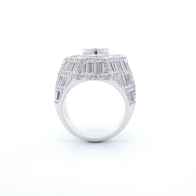 Quality, craftsmanship, and value come together in this striking designer gentlemen’s ring. Featuring an impressive 5.80 carats of baguette diamonds in a stunning halo setting, this ring radiates sophistication and brilliance. Accentuating its bold