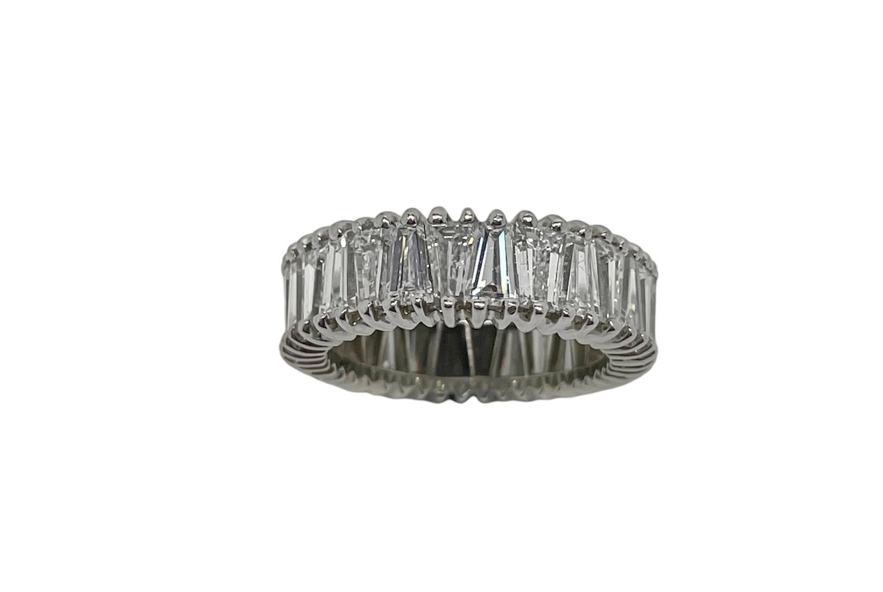 This unique eternity bands is beautifully made with 28 top quality tapered baguette cut diamonds weighing approximately 7.00 carats total. Mounted in platinum, this ring is different than your everyday round brilliant cut eternity band!

Ring size 6