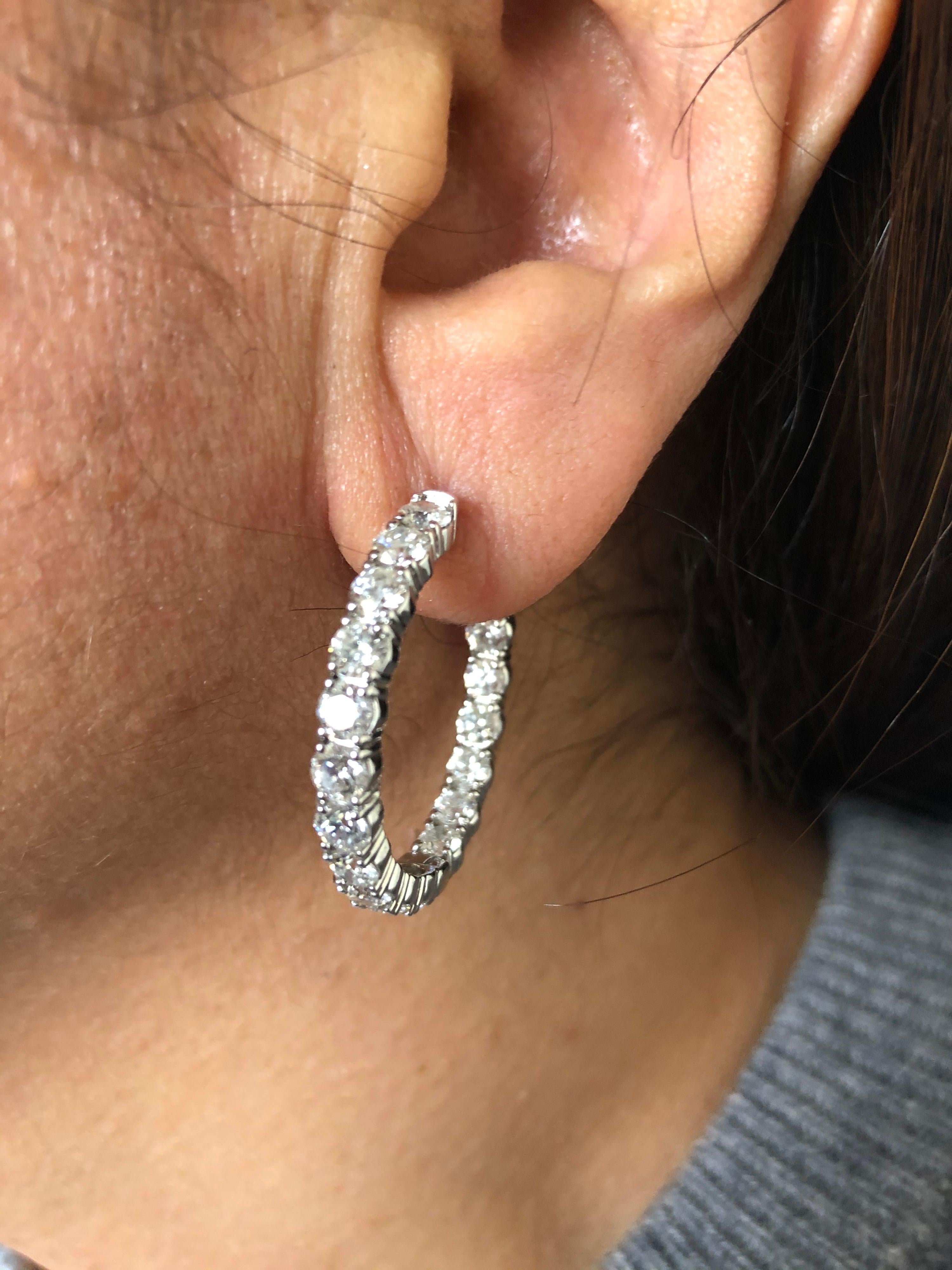 Inside and out diamond hoop earrings set in 14K white gold. The diameter is 1.25 Inches. Each stone weighs 0.20 carats and the total carat weight is 7.20. The color of the stones are G-H, the clarity is SI1.