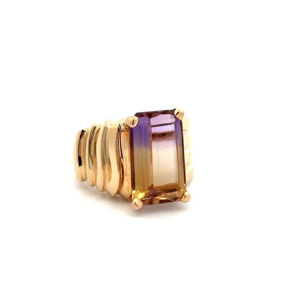 Simply Beautiful! Elegant and finely detailed Gold Solitaire Cocktail Ring. Centering a securely nestled Hand set 7 Carat Emerald Cut Ametrine. Beautifully Hand crafted 14K Yellow Gold mounting. Ring size: 8.25. In excellent condition and was