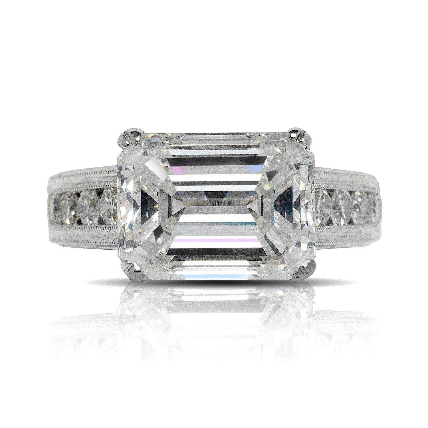 YOKO EMERALD CUT DIAMOND ENGAGEMENT RING 18K WHITE GOLD BY MIKE NEKTA
GIA CERTIFIED
Center Diamond
Carat Weight: 5.7 Carats
Color:  H*
Clarity: VVS1
Style:  EMERALD CUT 
Measurements:  11.5 x 8.6 x 5.9 mm
* This diamond has been treated by one or