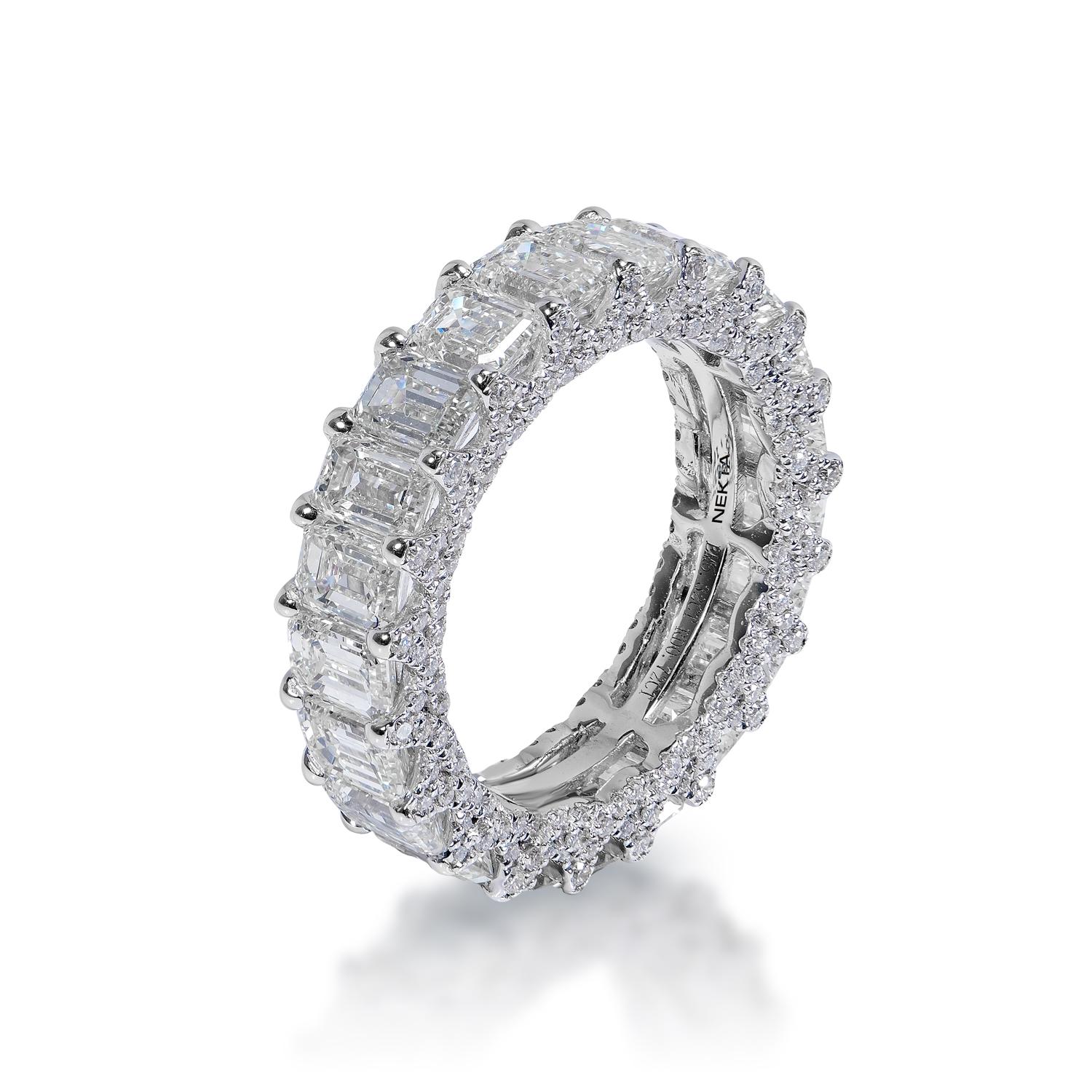 Diamond:
Carat Weight: 6.32 Carats 
Color: F.A
Style: Emerald Cut

Carat Weight: 0.72 Carats
Shape: Round Brilliant Cut
Setting: Shared Prong & pave
Metal: 14k White Gold 5.10 grams

Total Carat Weight: 7.04 Carats