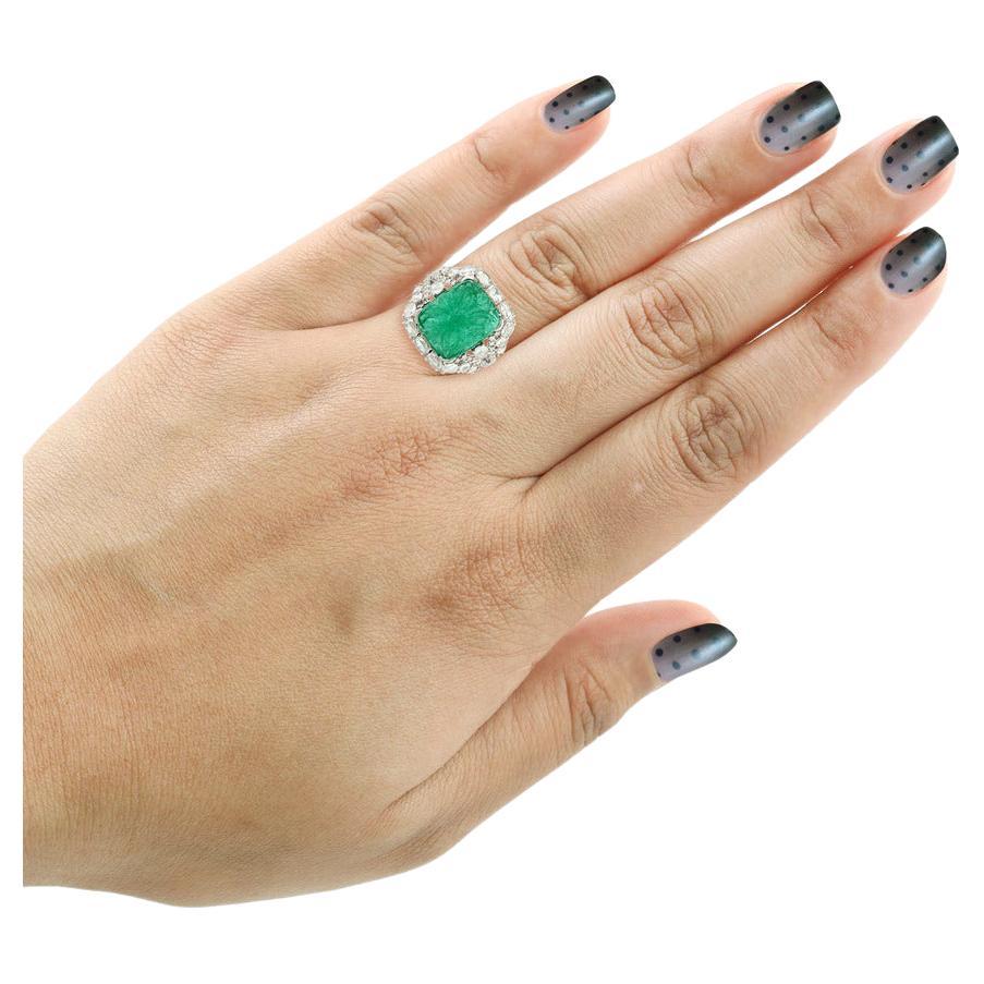 
7 Carat Emerald with 53 diamonds is a wow factor and also the  flower carved  into Emeralds is really makes a impression.  

The first known emerald mines were in Egypt, dating from at least 330 BC into the 1700s. ... Emeralds from what is now