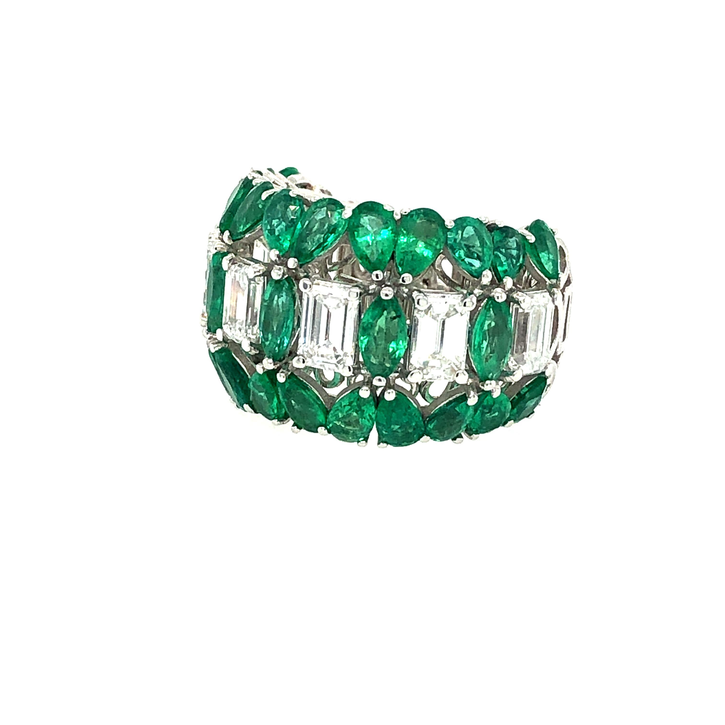Offered here is a stunning emerald and diamond ring set in 18kt white gold. The craftsmanship of the ring is superb. The ring has five ( 5 ) natural emerald cut diamonds G color Vs1 in clarity with an estimated total weight of 2.25 carats, plus you
