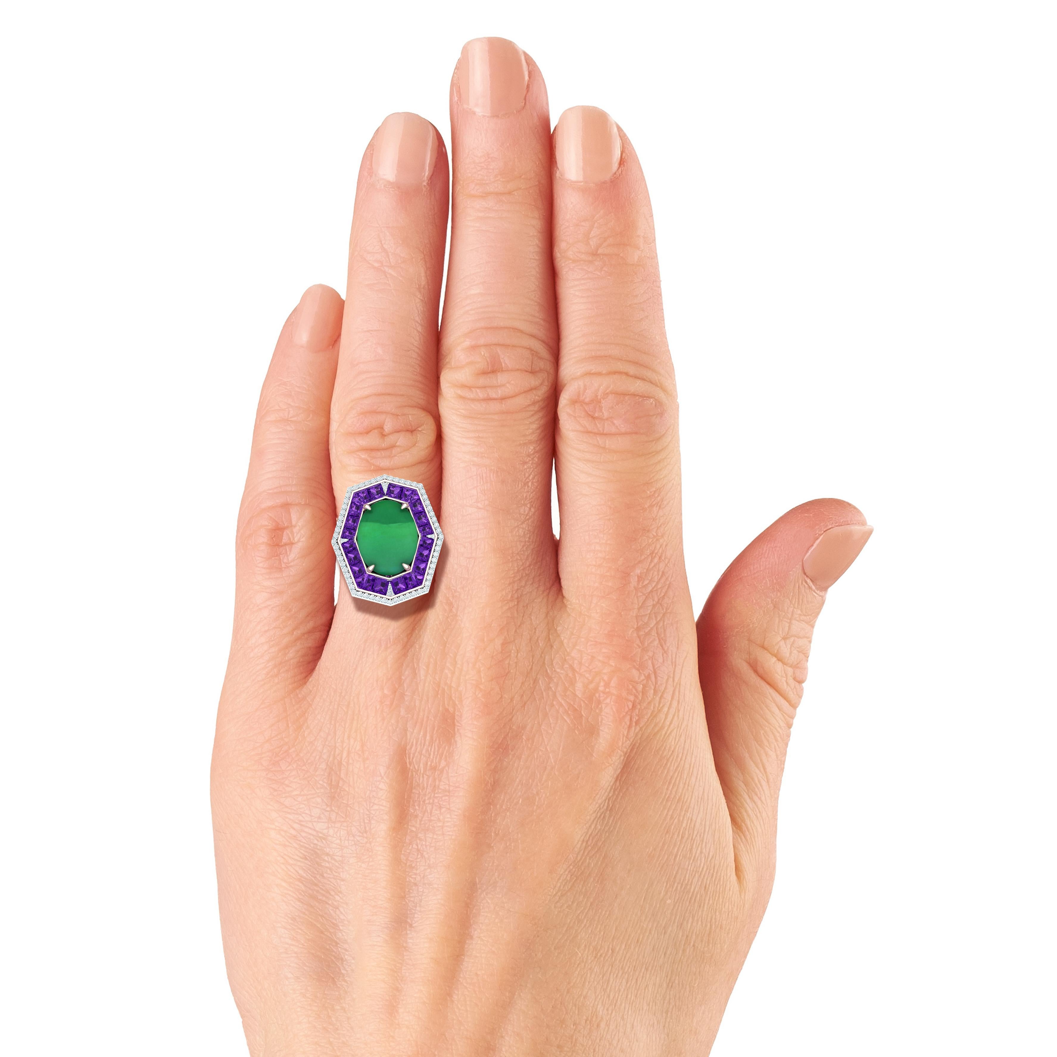 A beautiful tribute the deco era, this Jade Sapphire and Diamond ring contains the following.  The center stone is GIA Certified #2215528092.  The center stone is 7.87 carats and has a even green color with high luster.  The center is surrounded by