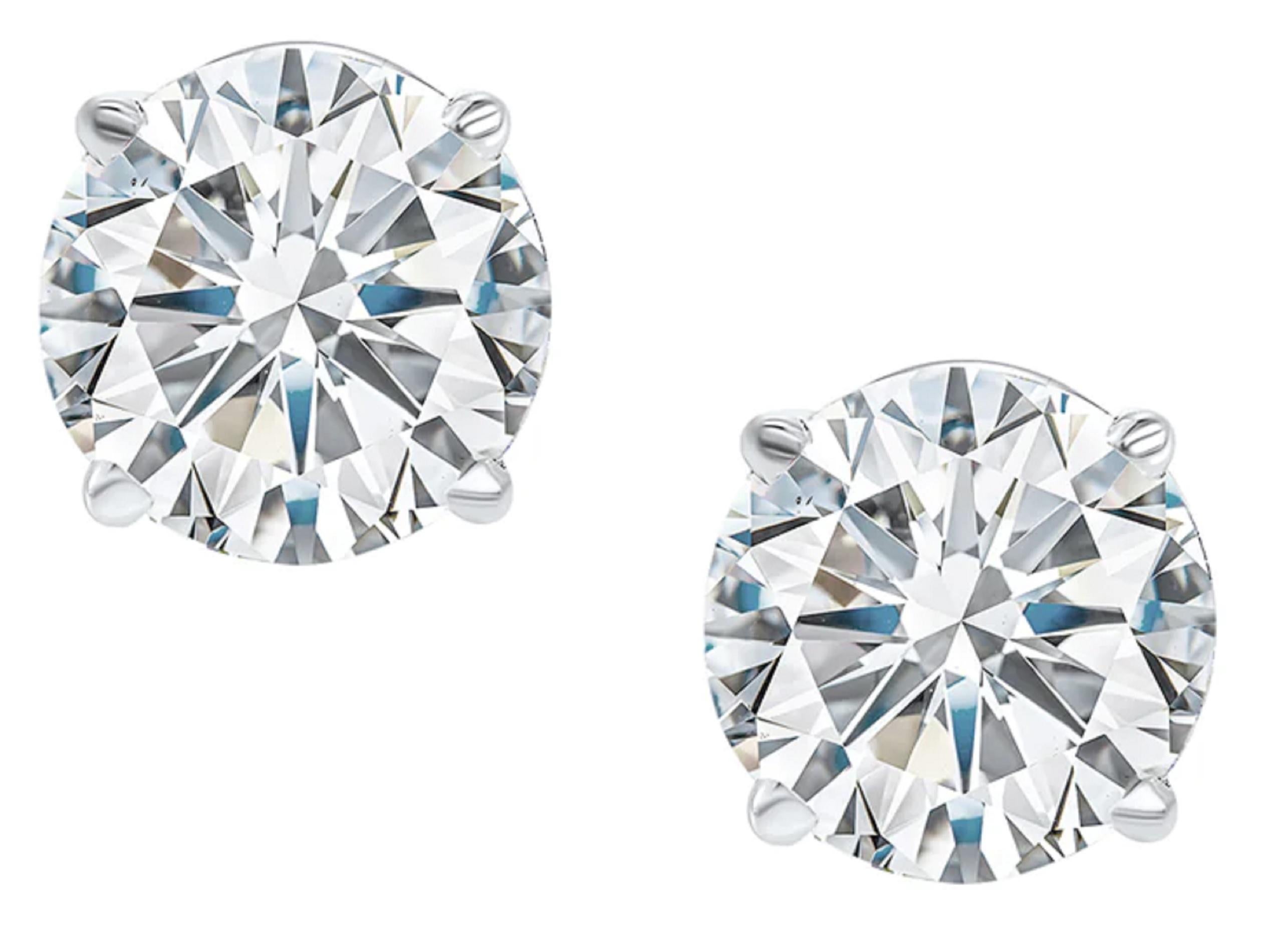 Modern 7 Carat Matched Pair of Round Cut Diamonds set in solid Platinum For Sale