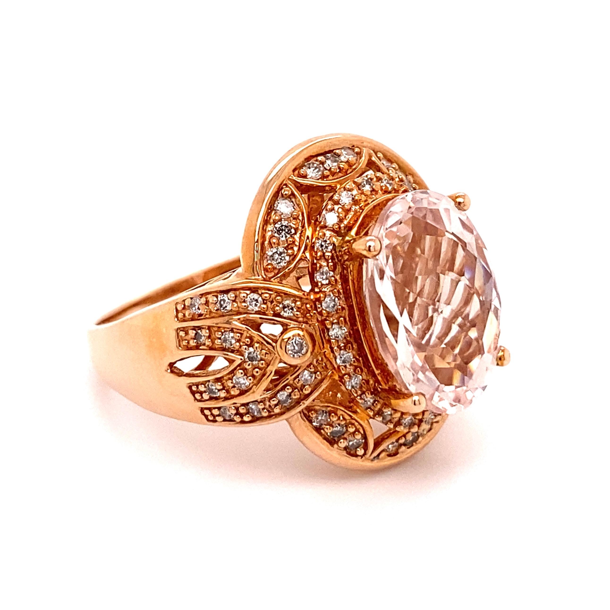 Simply Beautiful! Finely detailed Morganite and Diamond Gold Cocktail Ring. Centering a Hand set securely nestled 7 Carat Oval Morganite, surrounded by Diamonds, weighing approx. 0.38tcw including sides and on shank. Artfully Hand crafted in 14K