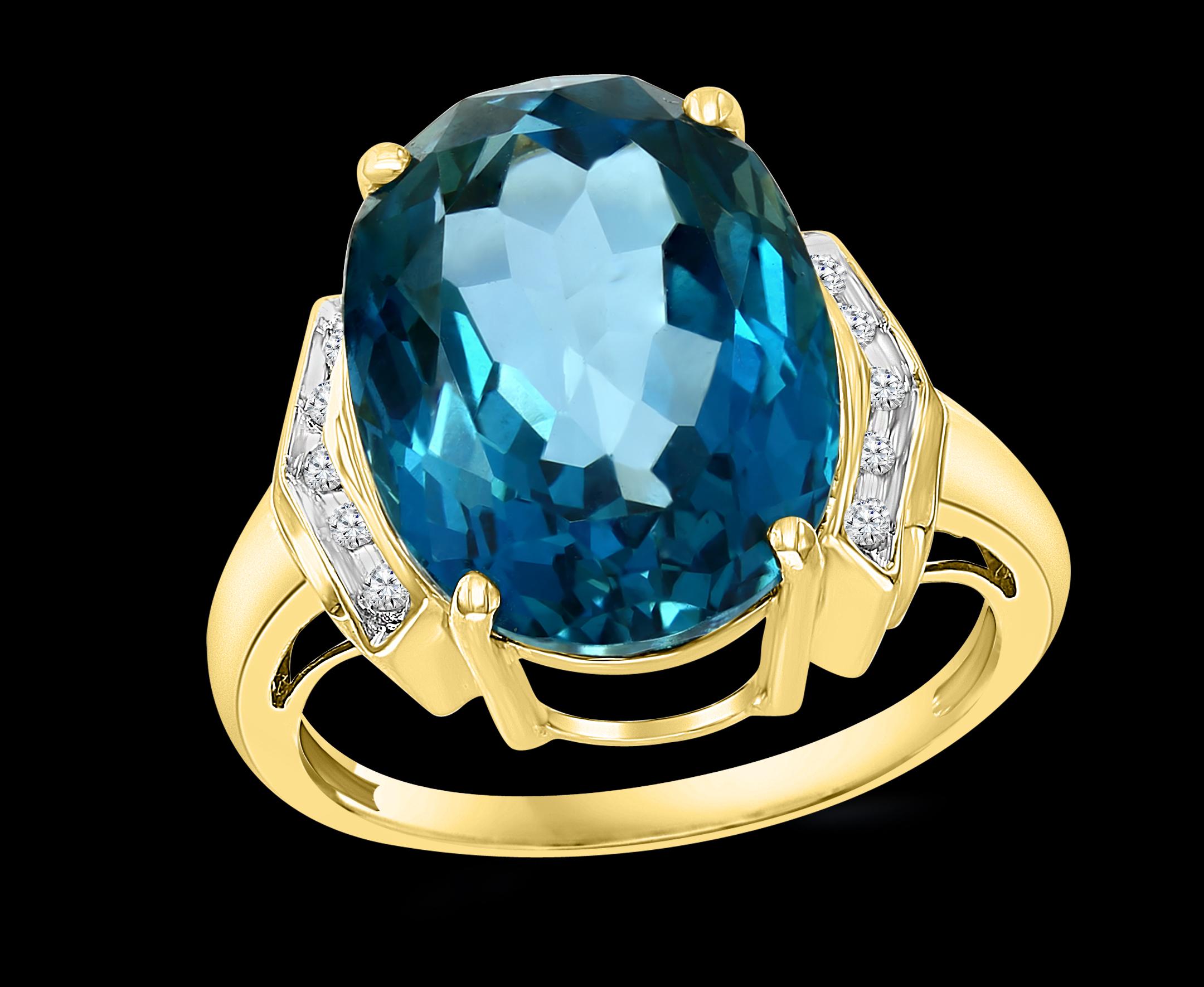 Approximately 7 Carat Natural Blue Topaz & Diamond Cocktail Ring 14 Karat Yellow Gold, Estate
A classic, Cocktail ring 
Huge 7 Carat of very clean no inclusion  Blue Topaz Oval shape , full of luster and shine with dark color
Approximately  0.25