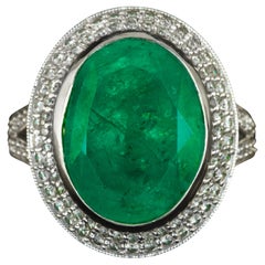 7 Carat Natural Oval Cut Vivid Green Emerald with Double Halo Pave Diamond Ring