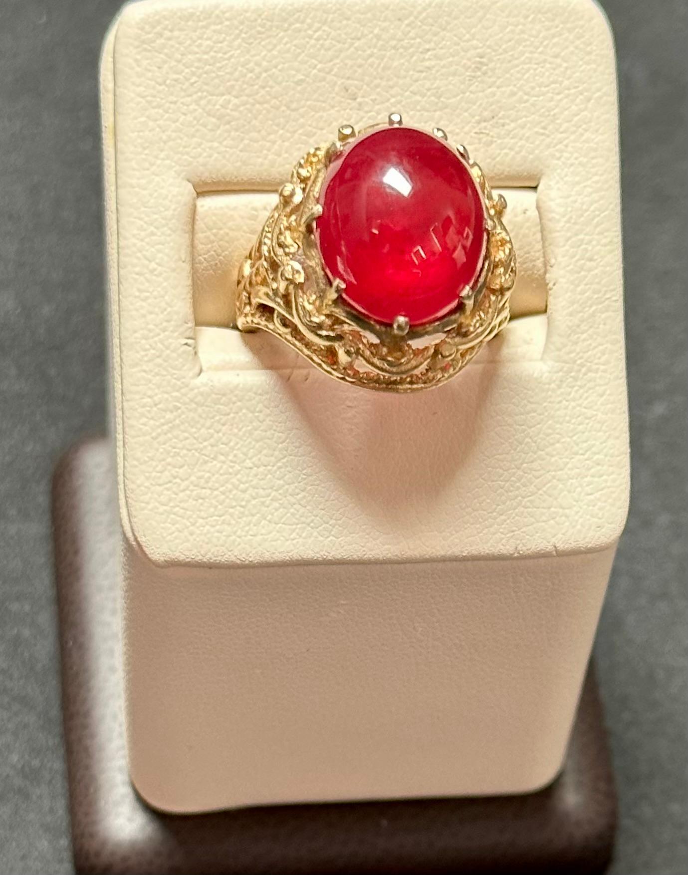 Introducing our stunning 14 Karat Yellow Gold Ring featuring a remarkable 7 carat Oval Cut Natural Pink Tourmaline Cabochon. This exquisite ring showcases the beauty of the pink tourmaline with its classic design and surrounding gold