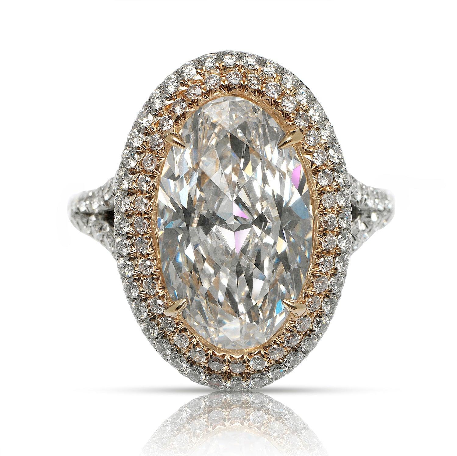 IRMA - OVAL CUT DOUBLE HALO  DIAMOND ENGAGEMENT RING BY MIKE NEKTA
GIA CERTIFIED 

Center Diamond:
Carat Weight: 5.3 Carats
Color : E*
Clarity: VVS1
Style: OVAL BRILLIANT
Approximate Measurements: 15.2 x 9.3 x 5.4 mm
* This diamond has been treated