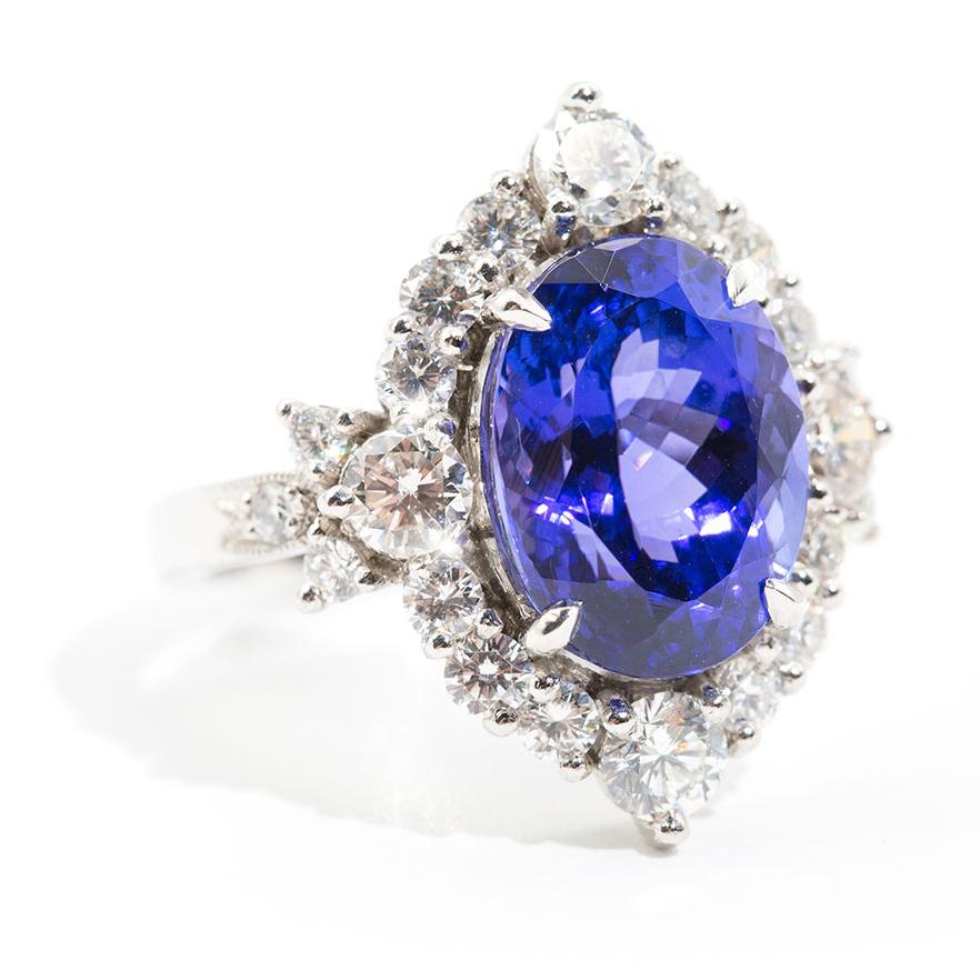 Forged in Platinum is this unique halo cluster ring featuring a mesmerising oval 7.00 carat tanzanite encompassed by 1.80 carats of sparkling round brilliant cut diamonds. We have named this gorgeous piece The Persia Ring. The Persia Ring is a