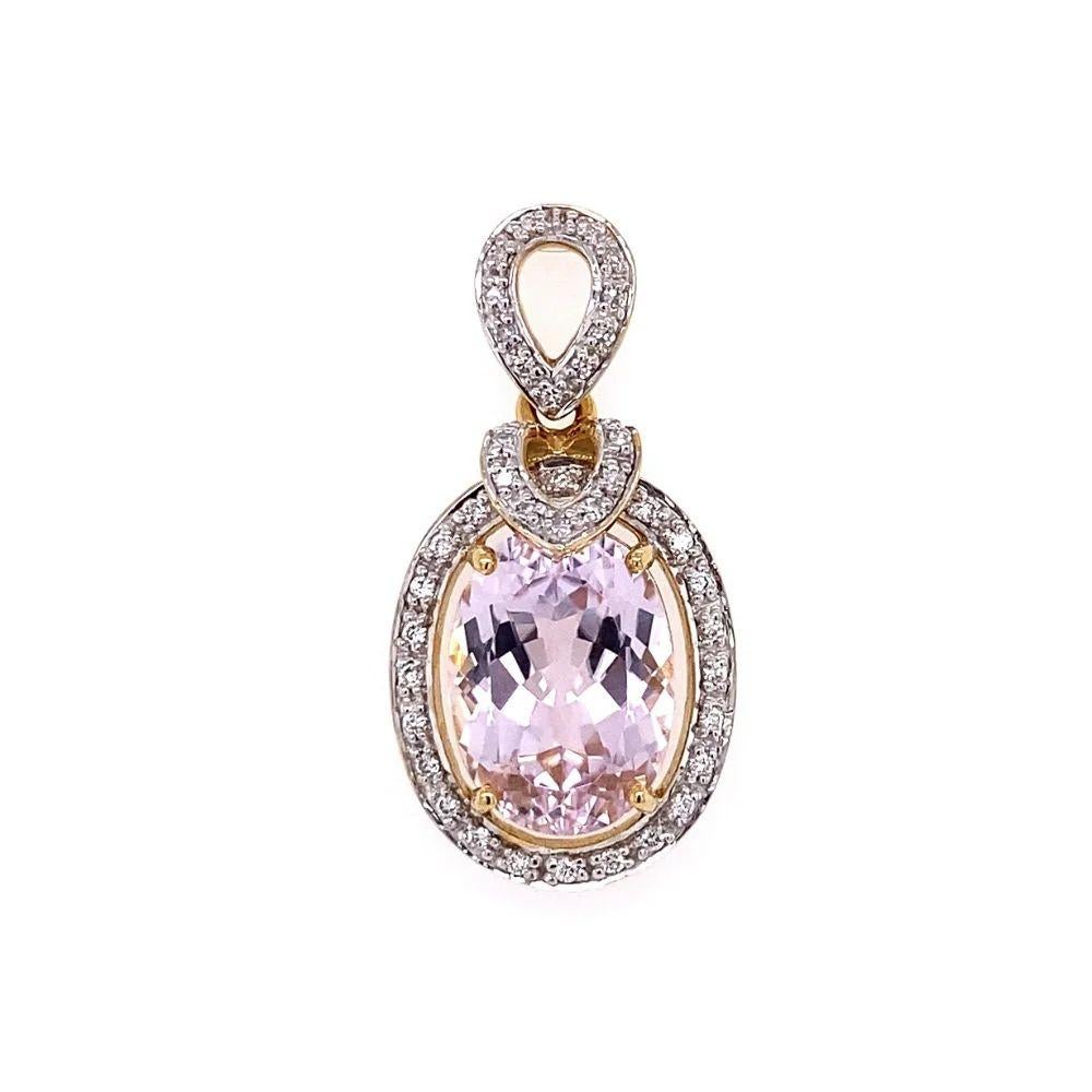 Exquisite Vintage 7 Carat Oval Kunzite and Diamond Pendant Necklace. Surrounded by Hand set Diamonds, weighing approx. 0.25tcw including bale. Beautifully Hand crafted 18K Yellow Gold. More Beautiful in real time! Chic and Timeless…Sure to be