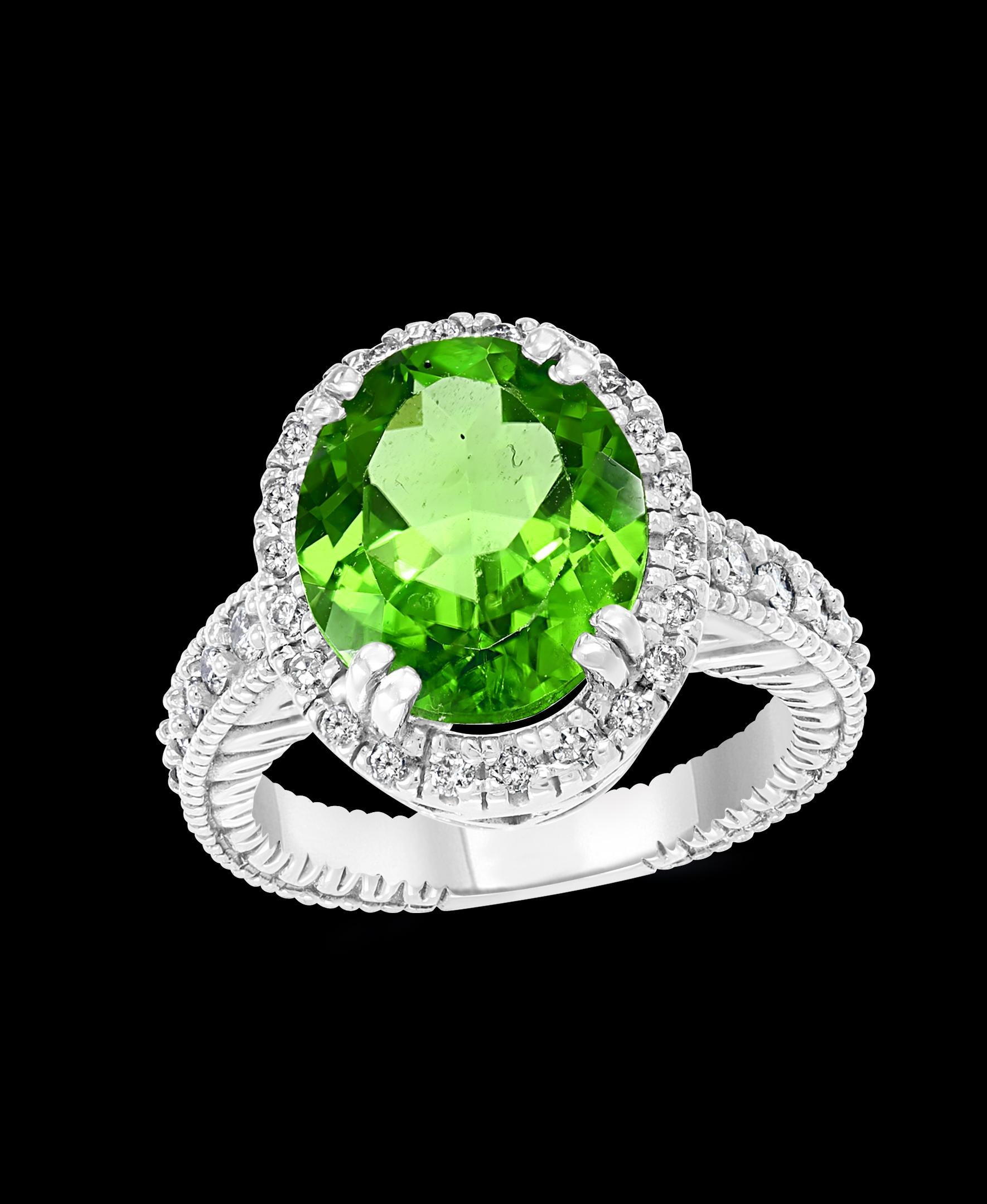 A classic, Cocktail ring 
7 Carat of very clean Pear Shape Peridot full of luster and shine and Diamond ring
Gold: 14 carat White gold 
Weight: 9 gram
Ring size 7
Diamonds: approximate 1.2 Carat , Brilliant round shape diamonds  
It’s very hard to