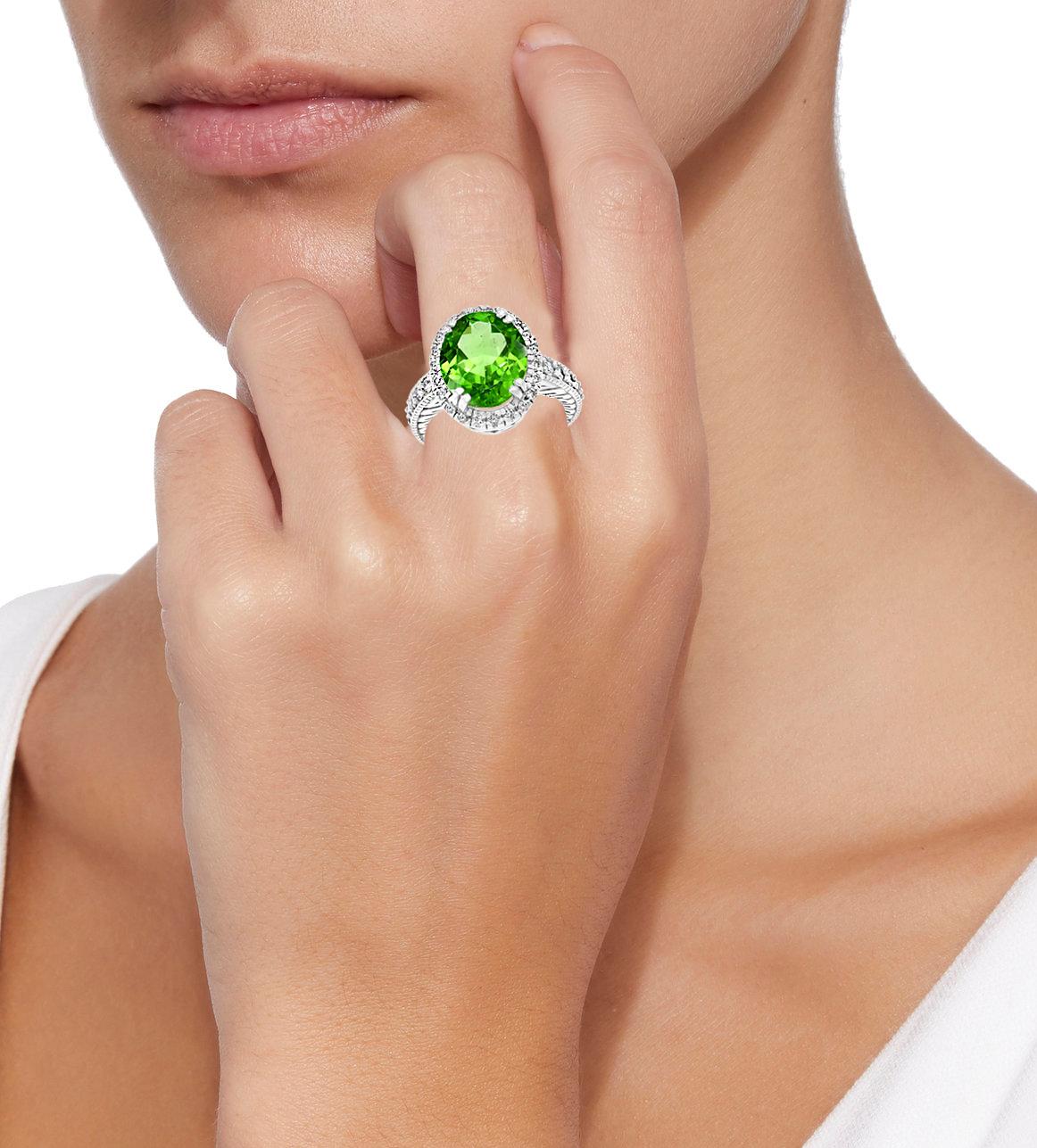 Oval Cut 7 Carat Oval Peridot and 1.2 Carat Diamonds 14 Karat White Gold Cocktail Ring For Sale