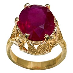 7 Carat Oval shape Treated Ruby 14 Karat Yellow Gold Ring