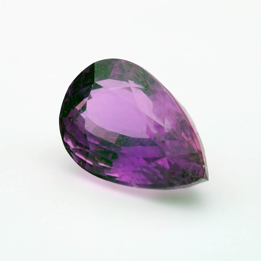 This exquisite Purple Tourmaline from Mozambique showcases an exceptionally rare and vibrant plum coloration—an unusual and highly sought-after variety in the Tourmaline family. Naturally formed and masterfully faceted, this gemstone exhibits rich