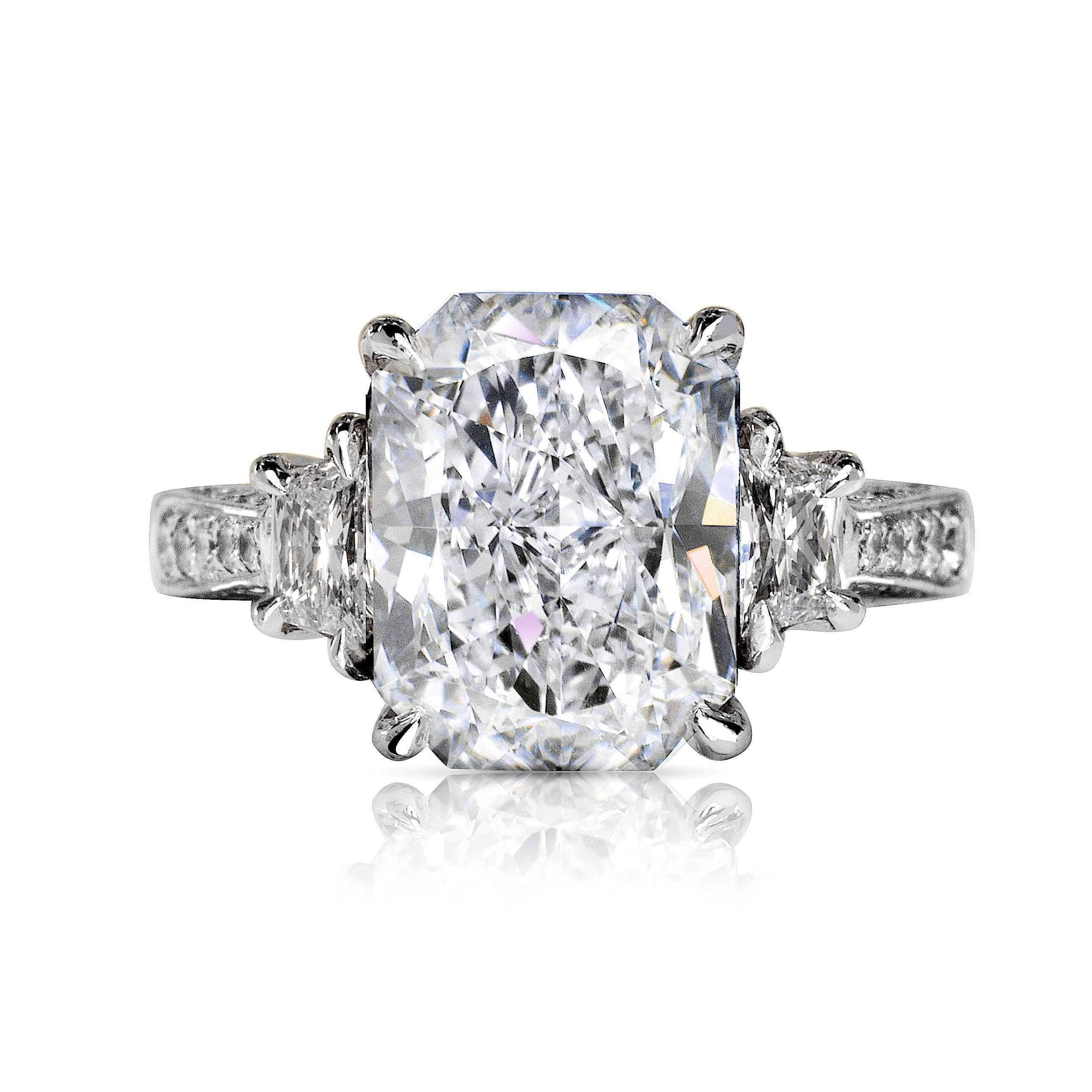 OLIVIA RADIANT FANCY YELLOW DIAMOND ENGAGEMENT RING 14K WHITE GOLD BY MIKE NEKTA
GIA CERTIFIED
 
Center Diamond:
Carat Weight: 5.5 Carats
Color :  F*
Clarity: VVS1
Style:  CUT-CORNERED RECTANGULAR MODIFIED BRILLIANT
Measurements: 11.7 x 8.9 x 5.9