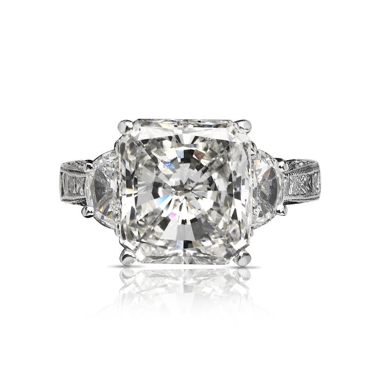 FREYJA RADIANT CUT DIAMOND ENGAGEMENT RING in 18K WHITE GOLD BY MIKE NEKTA
GIA CERTIFIED
 
Center Diamond:
Carat Weight: 5 Carats
Color : H
Clarity: VS2
Style: CUT-CORNERED RECTANGULAR MODIFIED BRILLIANT / Radiant
Measurements: 10.6 x 9.7 x 6.1 mm
