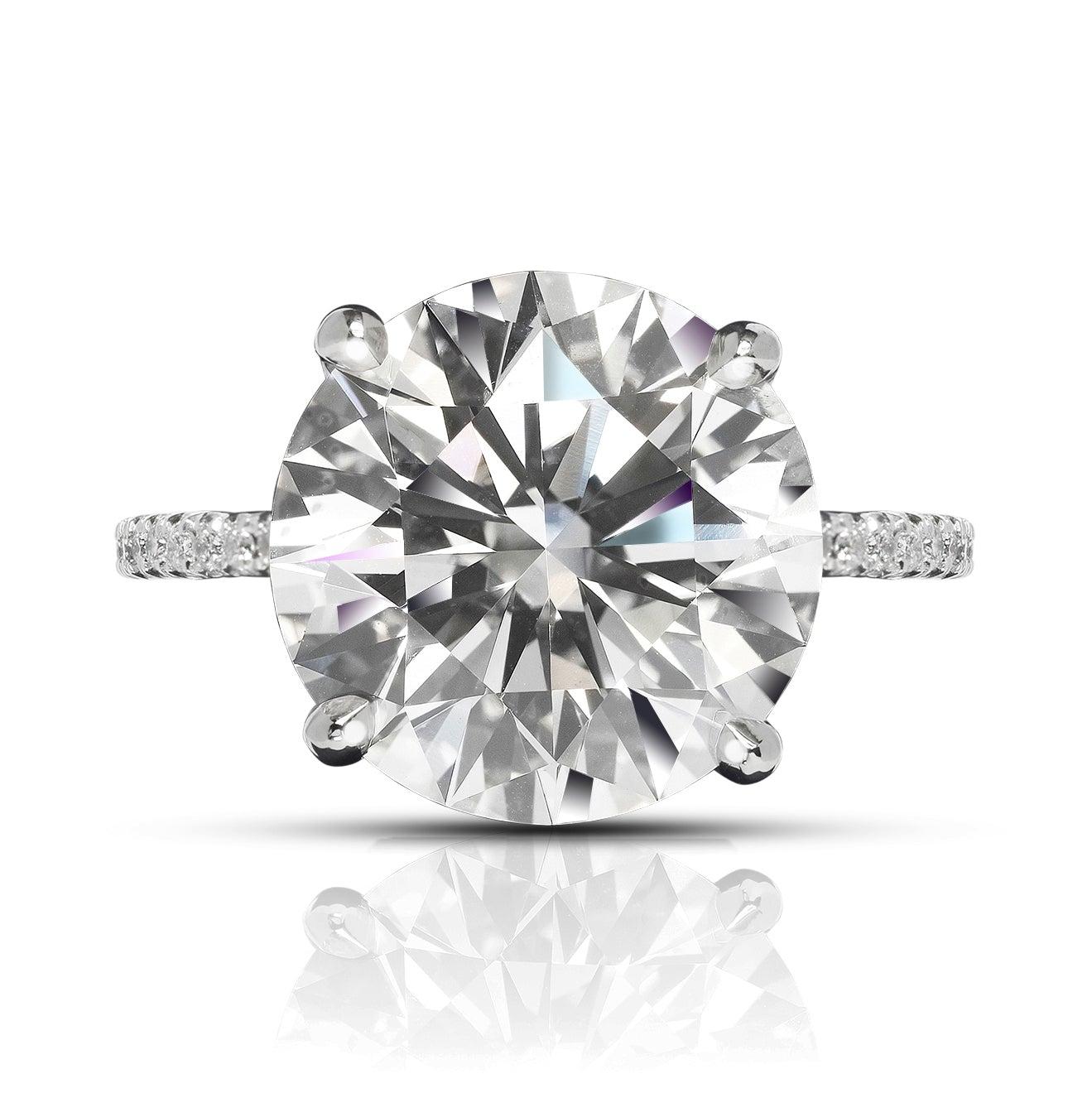 RILEY DIAMOND ENGAGEMENT 18K WHITE GOLD RING BY MIKE NEKTA
GIA CERTIFIED
 
Center Diamond:
Carat Weight: 6 Carat
Color: I
Clarity: SI2  
Style: ROUND BRILLIANT CUT
Measurements: ﻿11.7 - 11.8 x 7.2 mm

Ring:
Metal: 18K WHITE GOLD
Style: Sidestones