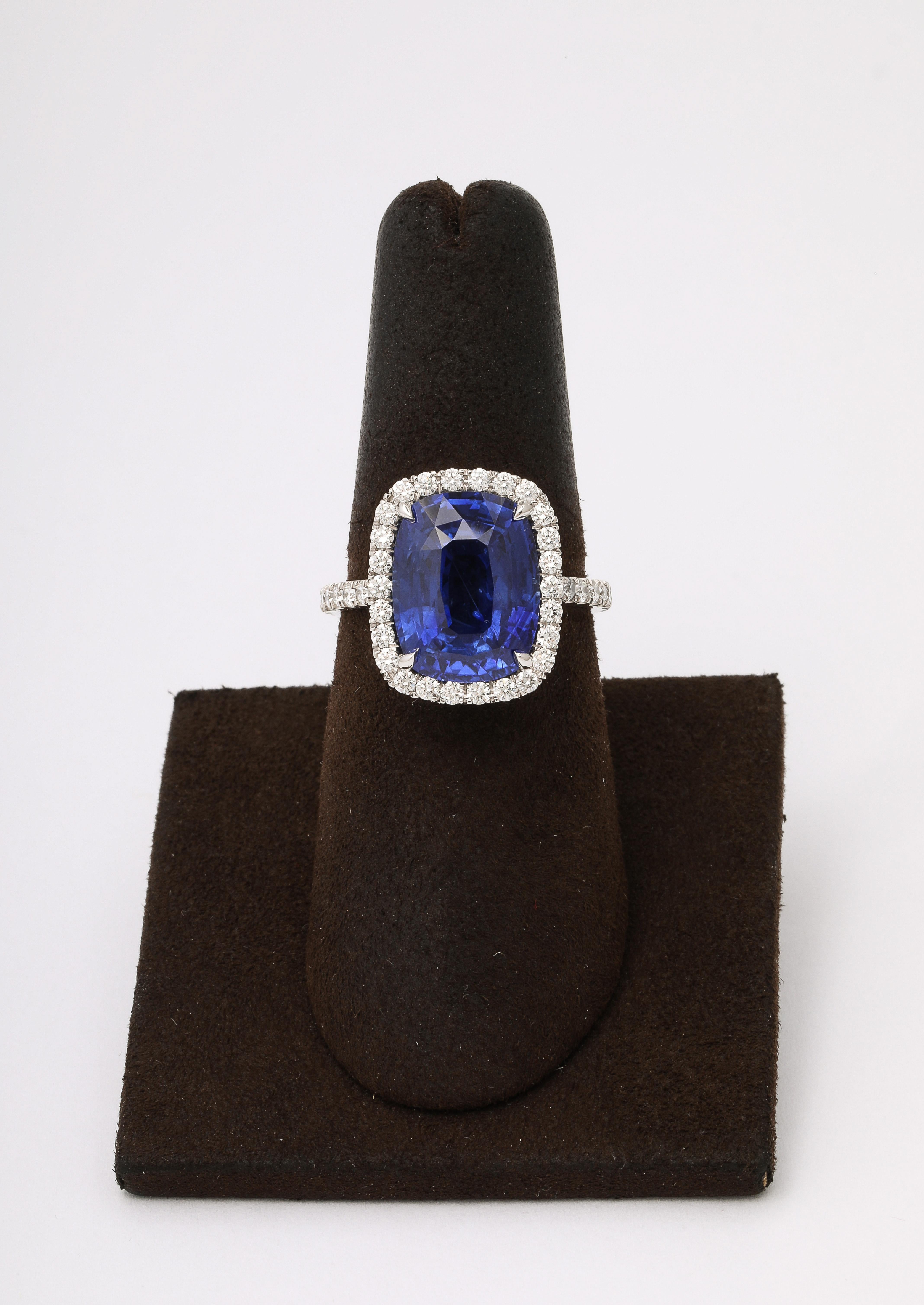 
An INCREDIBLE Sapphire! 

7.94 carat VIVID BLUE Cushion Cut, Ceylon Sapphire.

Set in a custom platinum and diamond mounting featuring .80 carats of white round brilliant cut diamonds.

Currently a size 6.5 - this ring can easily be resized.