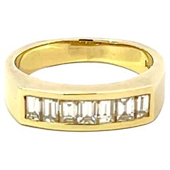 Bague jonc en or jaune 14 carats avec 7 diamants baguettes sertis en bande